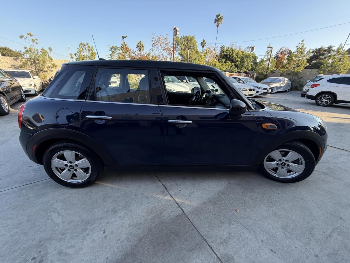 2015 Deep Blue Metallic /Black Mini Cooper Base (WMWXS5C50FT) with an 1.5L L3 engine, Automatic transmission, located at 30 S. Berkeley Avenue, Pasadena, CA, 91107, (626) 248-7567, 34.145447, -118.109398 - 2015 MINI Cooper Hardtop – Deep Blue Metallic | Style, Efficiency and Easy Financing in Pasadena Drive away in this stylish and fun-to-drive 2015 MINI Cooper Hardtop, finished in stunning Deep Blue Metallic with a black interior. Compact, sporty, and full of character, this MINI delivers worl- Photo#5