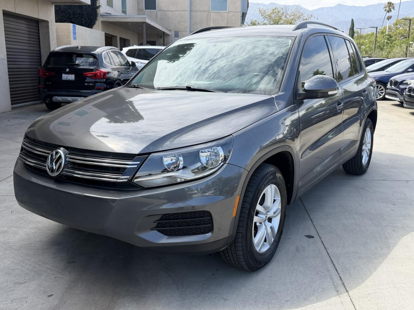 2015 Gray /BLACK Volkswagen Tiguan S (WVGAV7AX8FW) with an 2.0L L4 DOHC 16V TURBO engine, 6-Speed Automatic transmission, located at 30 S. Berkeley Avenue, Pasadena, CA, 91107, (626) 248-7567, 34.145447, -118.109398 - # 2015 Volkswagen Tiguan for Sale in Pasadena, CA – Buy Here Pay Here Financing Available If you're looking for a reliable, fuel-efficient, and versatile SUV, this 2015 Volkswagen Tiguan is an excellent choice. Available now at Crown City Motors in Pasadena, California, this Tiguan combines Ger- Photo#0