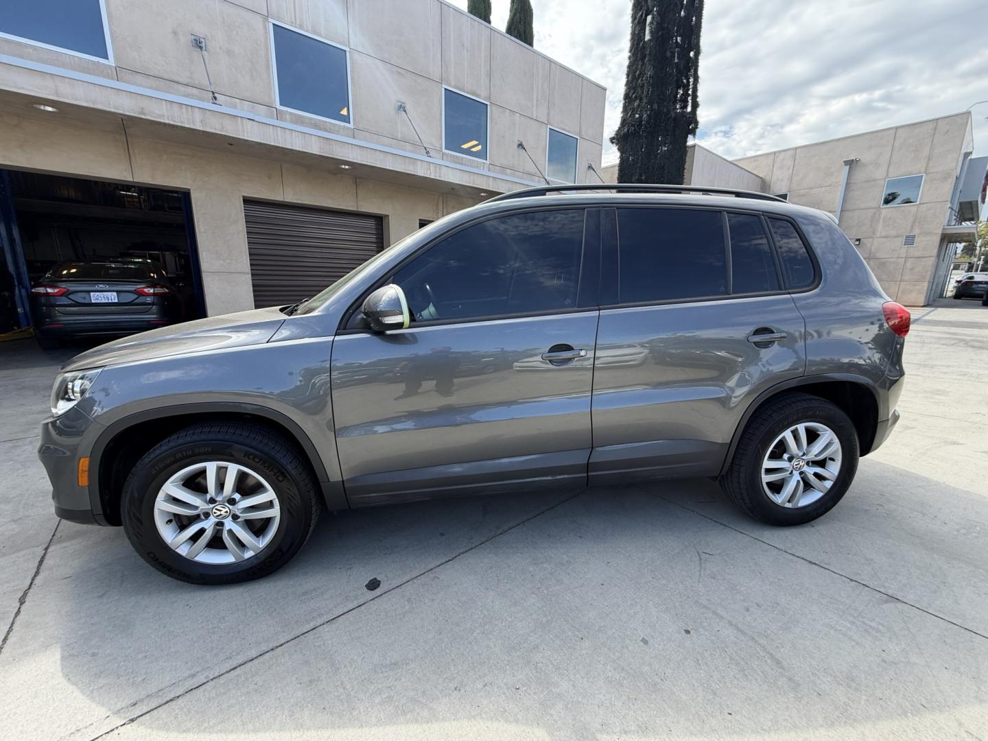 2015 Gray /BLACK Volkswagen Tiguan S (WVGAV7AX8FW) with an 2.0L L4 DOHC 16V TURBO engine, 6-Speed Automatic transmission, located at 30 S. Berkeley Avenue, Pasadena, CA, 91107, (626) 248-7567, 34.145447, -118.109398 - # 2015 Volkswagen Tiguan for Sale in Pasadena, CA – Buy Here Pay Here Financing Available If you're looking for a reliable, fuel-efficient, and versatile SUV, this 2015 Volkswagen Tiguan is an excellent choice. Available now at Crown City Motors in Pasadena, California, this Tiguan combines Ger- Photo#1
