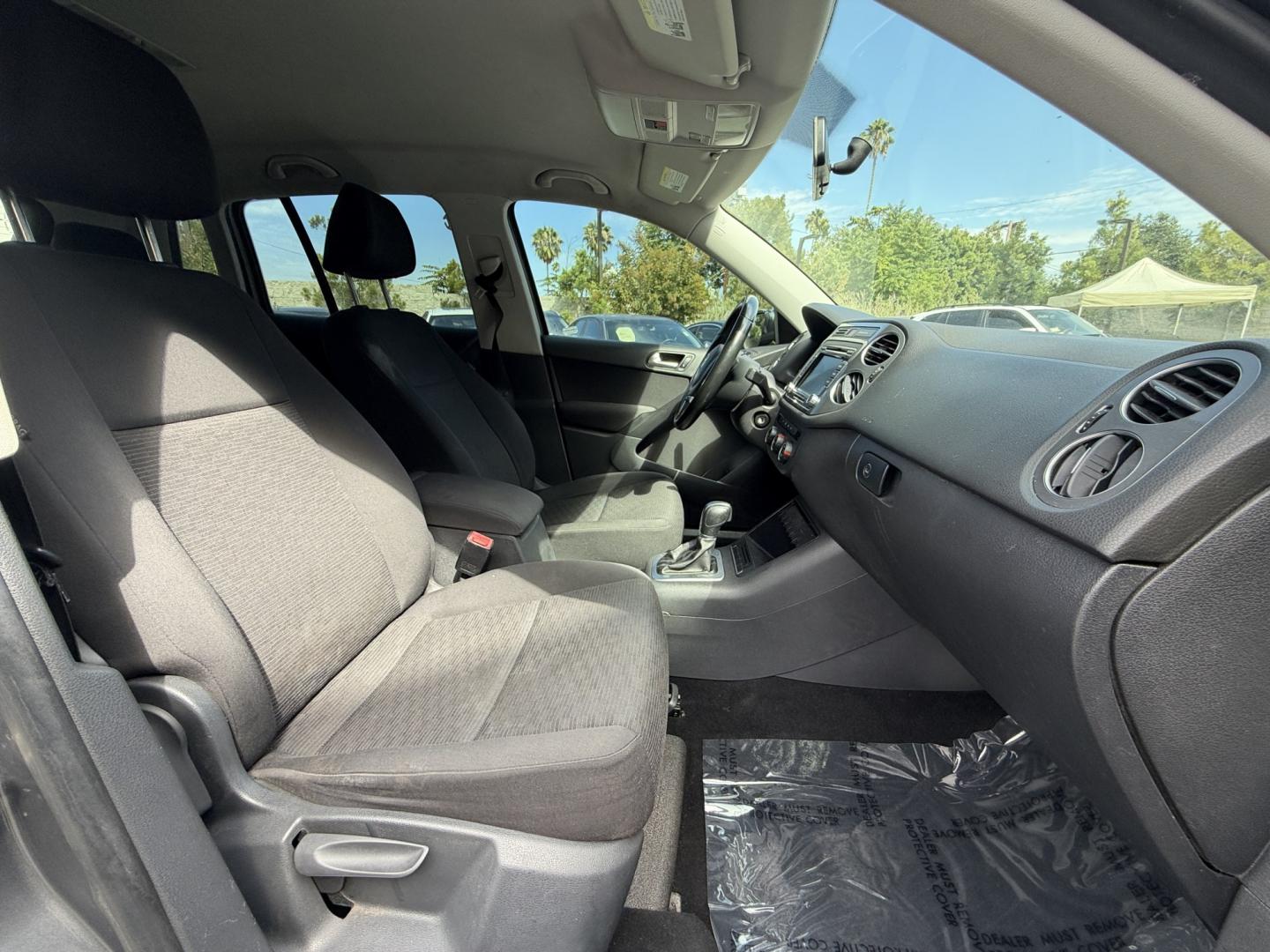 2015 Gray /BLACK Volkswagen Tiguan S (WVGAV7AX8FW) with an 2.0L L4 DOHC 16V TURBO engine, 6-Speed Automatic transmission, located at 30 S. Berkeley Avenue, Pasadena, CA, 91107, (626) 248-7567, 34.145447, -118.109398 - # 2015 Volkswagen Tiguan for Sale in Pasadena, CA – Buy Here Pay Here Financing Available If you're looking for a reliable, fuel-efficient, and versatile SUV, this 2015 Volkswagen Tiguan is an excellent choice. Available now at Crown City Motors in Pasadena, California, this Tiguan combines Ger- Photo#11
