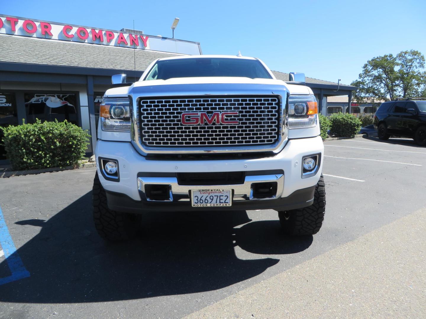 2016 GMC Sierra 2500HD Denali Crew Cab 4WD (1GT12UE8XGF) with an 6.6L V8 OHV 16 DIESEL engine, 6A transmission, located at 2630 Grass Valley Highway, Auburn, CA, 95603, (530) 508-5100, 38.937893, -121.095482 - Lifted Denali 2500 featuring a Pro Comp 6" lift kit, 20" Fuel Nutz wheels, 35" Nitto Ridge Grappler tires, Amp power steps, and Weathertech floor liners. - Photo#1