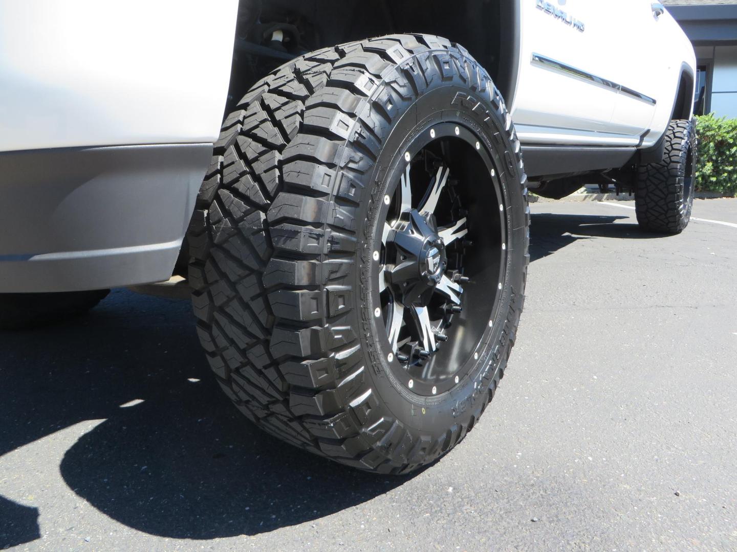 2016 GMC Sierra 2500HD Denali Crew Cab 4WD (1GT12UE8XGF) with an 6.6L V8 OHV 16 DIESEL engine, 6A transmission, located at 2630 Grass Valley Highway, Auburn, CA, 95603, (530) 508-5100, 38.937893, -121.095482 - Lifted Denali 2500 featuring a Pro Comp 6" lift kit, 20" Fuel Nutz wheels, 35" Nitto Ridge Grappler tires, Amp power steps, and Weathertech floor liners. - Photo#12