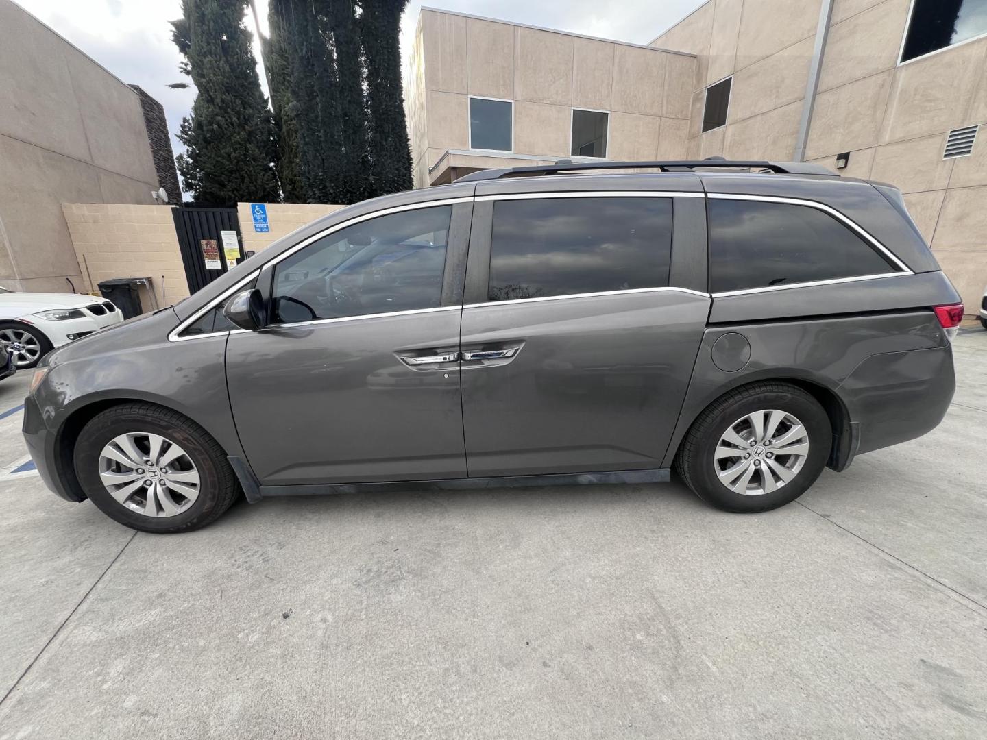 2016 Gray /Gray Honda Odyssey SE (5FNRL5H38GB) with an 3.5L V6 SOHC 24V engine, 6A transmission, located at 30 S. Berkeley Avenue, Pasadena, CA, 91107, (626) 248-7567, 34.145447, -118.109398 - For sale at Crown City Motors, 30 S Berkeley Ave, Pasadena, CA 91107: a reliable 2016 Honda Odyssey with rear AC, perfect for families needing a spacious 7-passenger minivan. This well-maintained vehicle offers a smooth ride, ample cargo space, and modern features to ensure comfort on every journey. - Photo#2