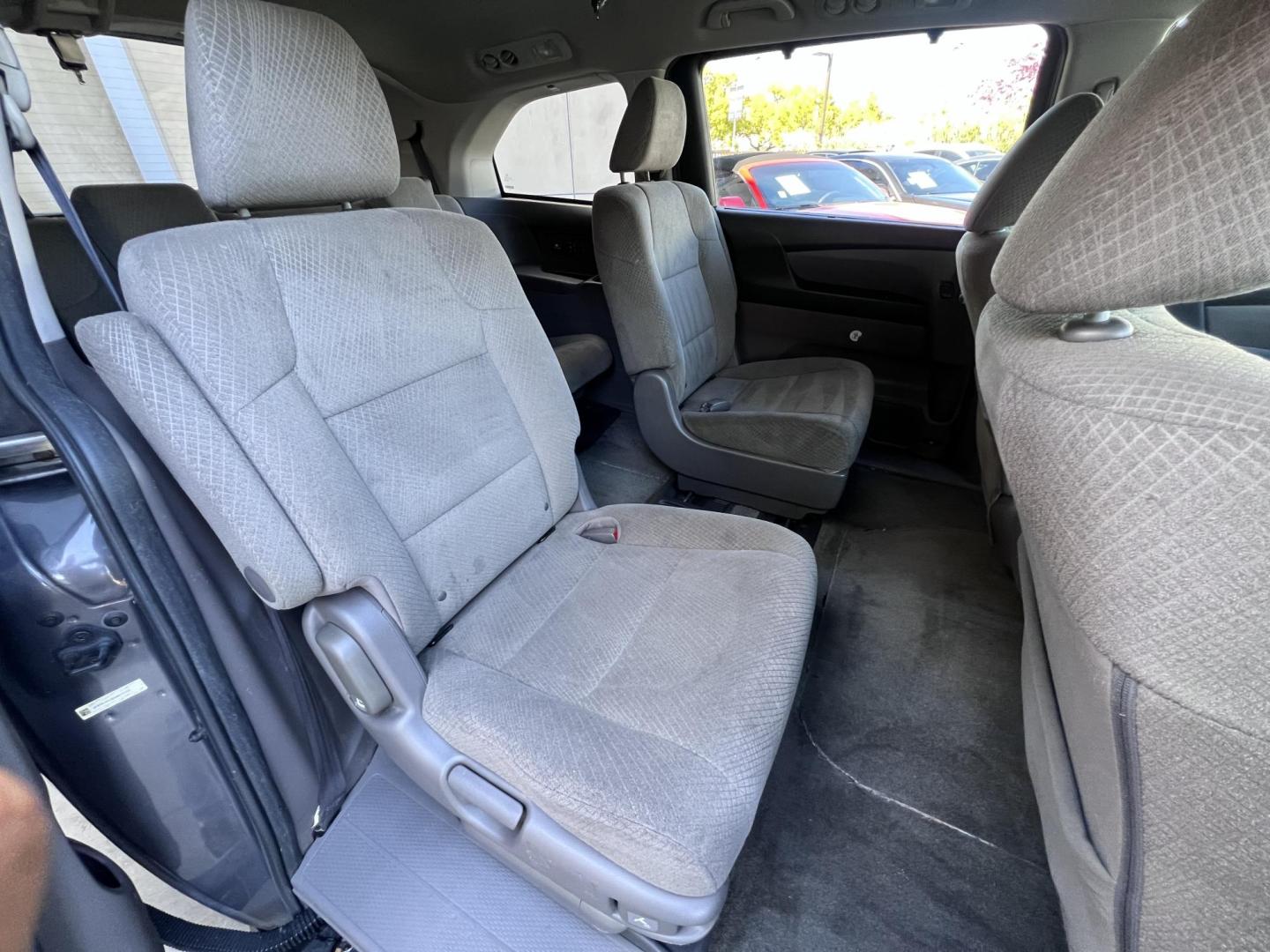 2016 Gray /Gray Honda Odyssey SE (5FNRL5H38GB) with an 3.5L V6 SOHC 24V engine, 6A transmission, located at 30 S. Berkeley Avenue, Pasadena, CA, 91107, (626) 248-7567, 34.145447, -118.109398 - For sale at Crown City Motors, 30 S Berkeley Ave, Pasadena, CA 91107: a reliable 2016 Honda Odyssey with rear AC, perfect for families needing a spacious 7-passenger minivan. This well-maintained vehicle offers a smooth ride, ample cargo space, and modern features to ensure comfort on every journey. - Photo#20