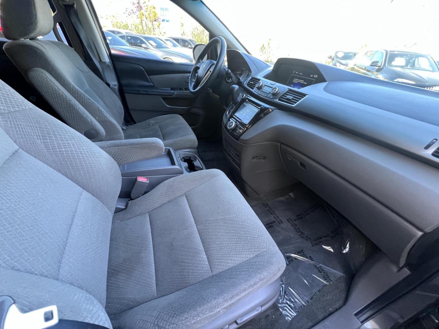 2016 Gray /Gray Honda Odyssey SE (5FNRL5H38GB) with an 3.5L V6 SOHC 24V engine, 6A transmission, located at 30 S. Berkeley Avenue, Pasadena, CA, 91107, (626) 248-7567, 34.145447, -118.109398 - For sale at Crown City Motors, 30 S Berkeley Ave, Pasadena, CA 91107: a reliable 2016 Honda Odyssey with rear AC, perfect for families needing a spacious 7-passenger minivan. This well-maintained vehicle offers a smooth ride, ample cargo space, and modern features to ensure comfort on every journey. - Photo#22