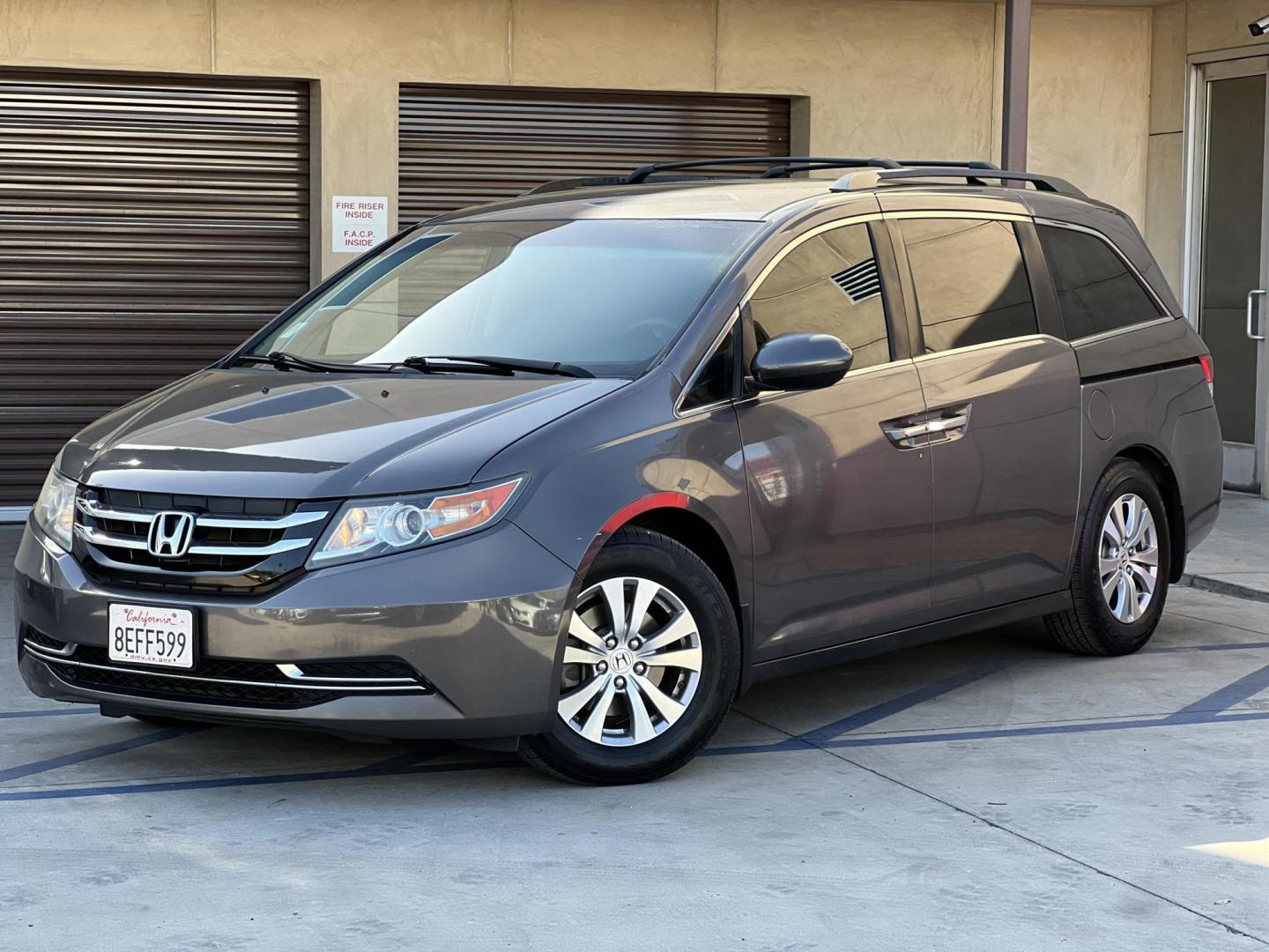 2016 Gray /Gray Honda Odyssey SE (5FNRL5H38GB) with an 3.5L V6 SOHC 24V engine, 6A transmission, located at 30 S. Berkeley Avenue, Pasadena, CA, 91107, (626) 248-7567, 34.145447, -118.109398 - For sale at Crown City Motors, 30 S Berkeley Ave, Pasadena, CA 91107: a reliable 2016 Honda Odyssey with rear AC, perfect for families needing a spacious 7-passenger minivan. This well-maintained vehicle offers a smooth ride, ample cargo space, and modern features to ensure comfort on every journey. - Photo#4
