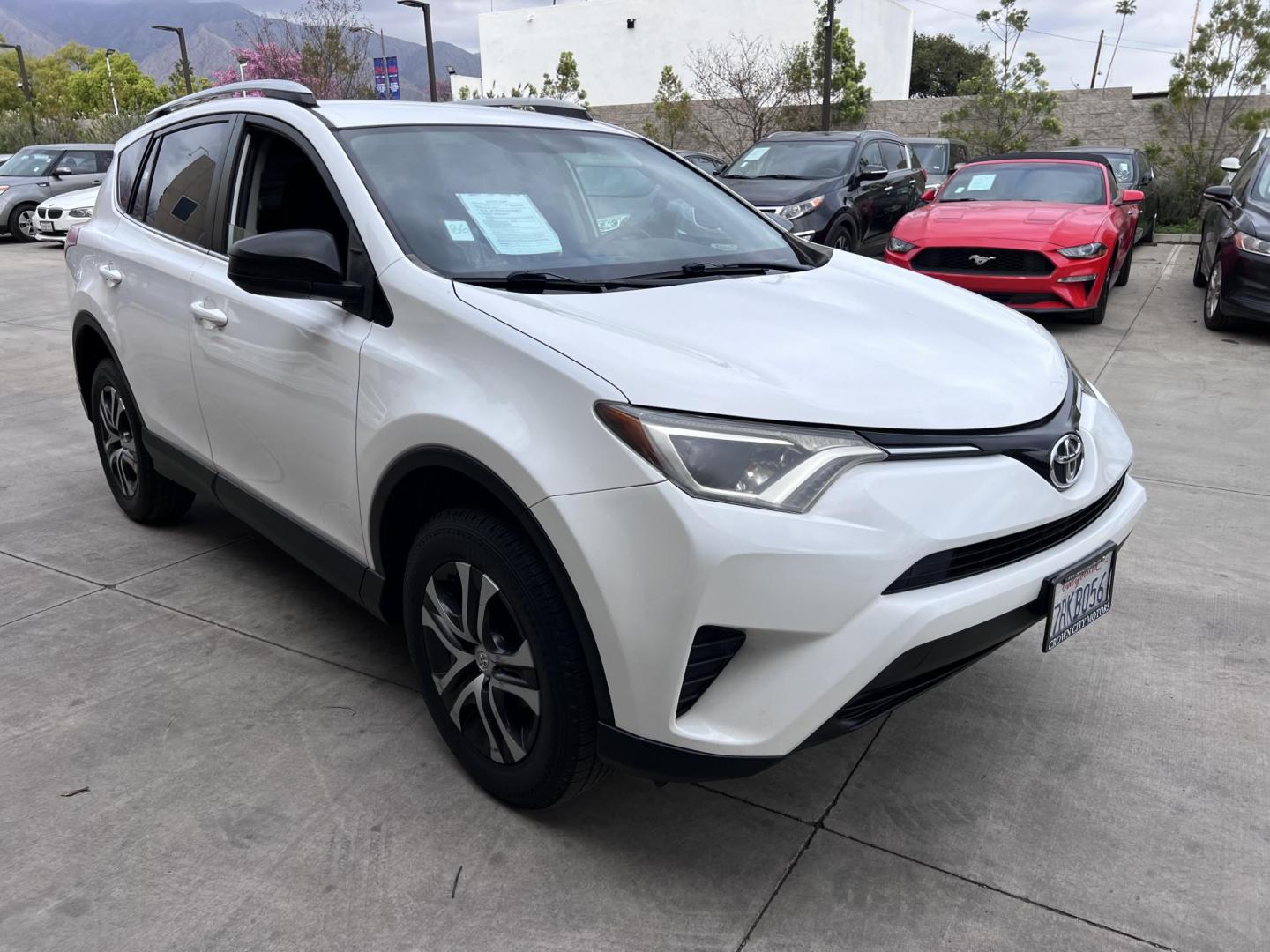 2016 White /Black Toyota RAV4 LE FWD (2T3ZFREV2GW) with an 2.5L L4 DOHC 16V engine, 6A transmission, located at 30 S. Berkeley Avenue, Pasadena, CA, 91107, (626) 248-7567, 34.145447, -118.109398 - 2016 Toyota RAV4 LE FWD – Reliable Compact SUV at Crown City Motors Are you searching for a dependable, stylish, and affordable compact SUV? Look no further than the 2016 Toyota RAV4 LE FWD, available now at Crown City Motors, located at 30 S Berkeley Ave, Pasadena, CA 91107. This popular crossov - Photo#12