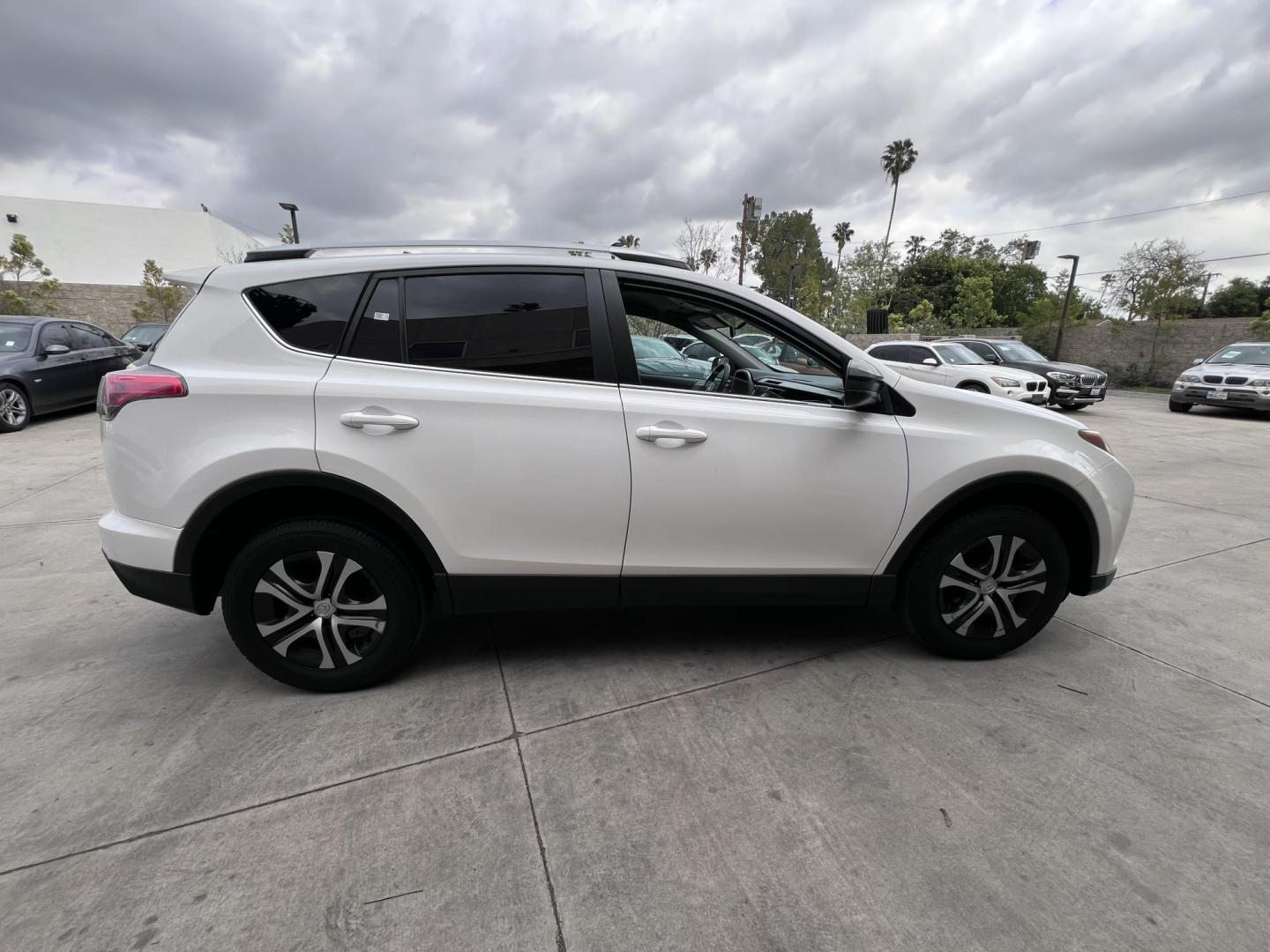 2016 White /Black Toyota RAV4 LE FWD (2T3ZFREV2GW) with an 2.5L L4 DOHC 16V engine, 6A transmission, located at 30 S. Berkeley Avenue, Pasadena, CA, 91107, (626) 248-7567, 34.145447, -118.109398 - 2016 Toyota RAV4 LE FWD – Reliable Compact SUV at Crown City Motors Are you searching for a dependable, stylish, and affordable compact SUV? Look no further than the 2016 Toyota RAV4 LE FWD, available now at Crown City Motors, located at 30 S Berkeley Ave, Pasadena, CA 91107. This popular crossov - Photo#13