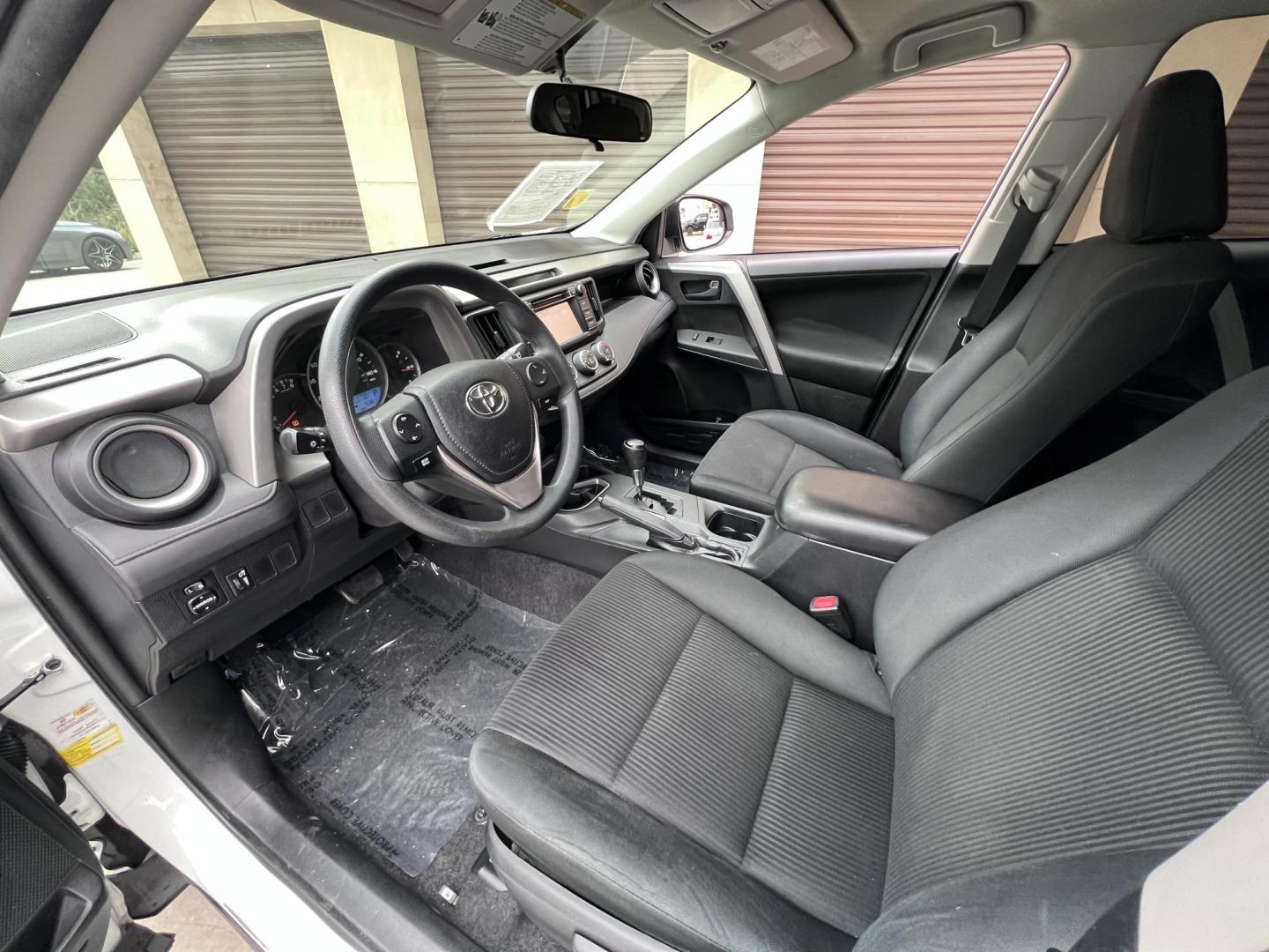 2016 White /Black Toyota RAV4 LE FWD (2T3ZFREV2GW) with an 2.5L L4 DOHC 16V engine, 6A transmission, located at 30 S. Berkeley Avenue, Pasadena, CA, 91107, (626) 248-7567, 34.145447, -118.109398 - 2016 Toyota RAV4 LE FWD – Reliable Compact SUV at Crown City Motors Are you searching for a dependable, stylish, and affordable compact SUV? Look no further than the 2016 Toyota RAV4 LE FWD, available now at Crown City Motors, located at 30 S Berkeley Ave, Pasadena, CA 91107. This popular crossov - Photo#24