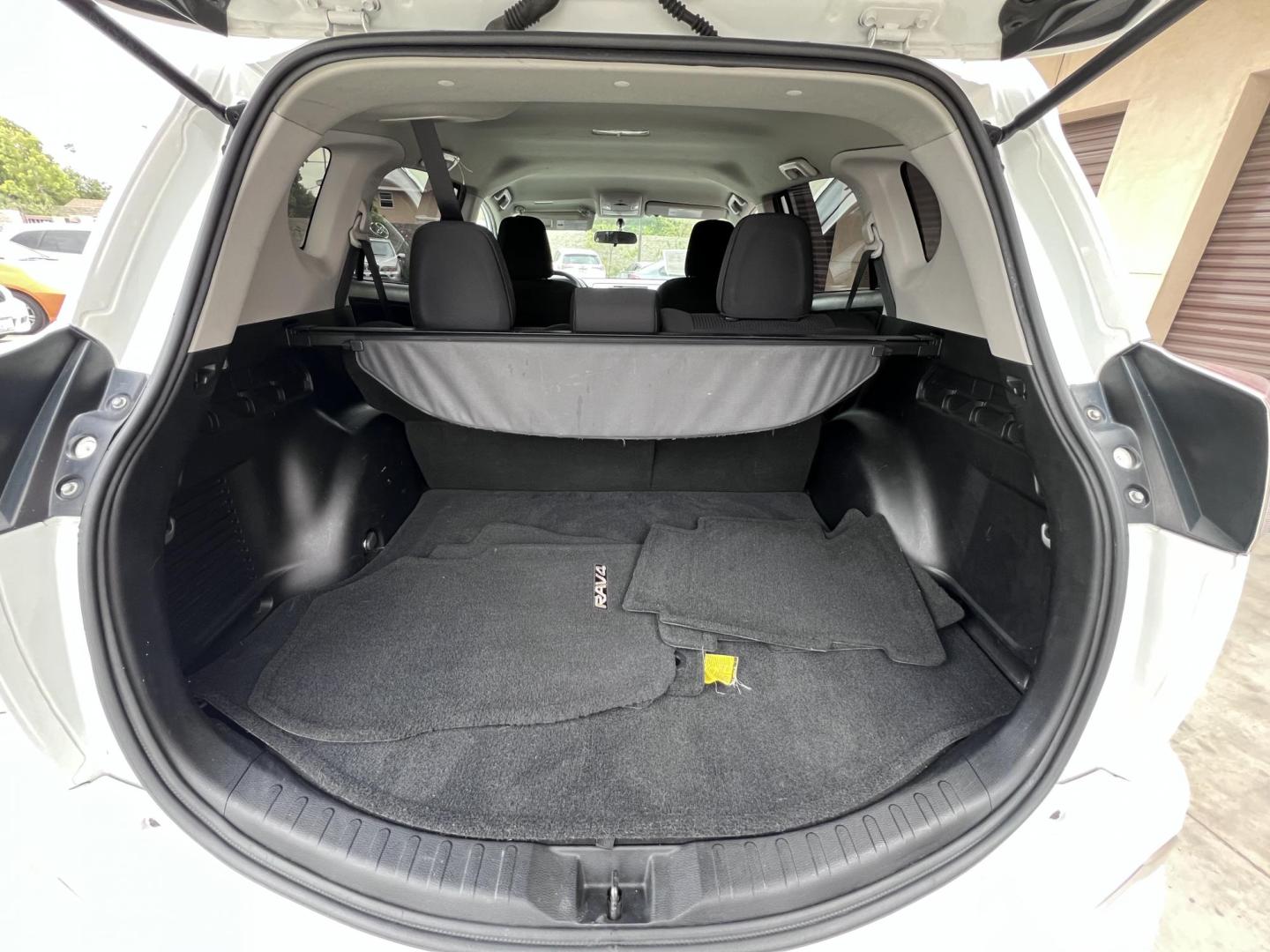 2016 White /Black Toyota RAV4 LE FWD (2T3ZFREV2GW) with an 2.5L L4 DOHC 16V engine, 6A transmission, located at 30 S. Berkeley Avenue, Pasadena, CA, 91107, (626) 248-7567, 34.145447, -118.109398 - 2016 Toyota RAV4 LE FWD – Reliable Compact SUV at Crown City Motors Are you searching for a dependable, stylish, and affordable compact SUV? Look no further than the 2016 Toyota RAV4 LE FWD, available now at Crown City Motors, located at 30 S Berkeley Ave, Pasadena, CA 91107. This popular crossov - Photo#28