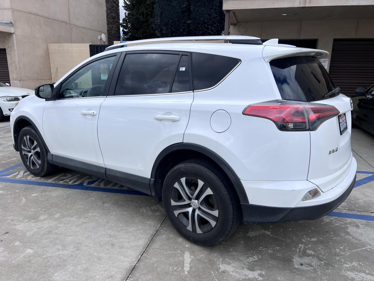 2016 White /Black Toyota RAV4 LE FWD (2T3ZFREV2GW) with an 2.5L L4 DOHC 16V engine, 6A transmission, located at 30 S. Berkeley Avenue, Pasadena, CA, 91107, (626) 248-7567, 34.145447, -118.109398 - 2016 Toyota RAV4 LE FWD – Reliable Compact SUV at Crown City Motors Are you searching for a dependable, stylish, and affordable compact SUV? Look no further than the 2016 Toyota RAV4 LE FWD, available now at Crown City Motors, located at 30 S Berkeley Ave, Pasadena, CA 91107. This popular crossov - Photo#1