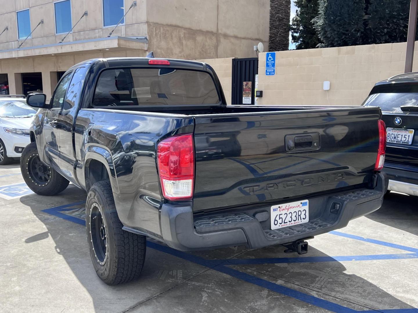 2016 BLACK /gray Toyota Tacoma SR5 Access Cab I4 6AT 2WD (5TFRX5GN4GX) with an 2.7L L4 DOHC 16V engine, 5A transmission, located at 30 S. Berkeley Avenue, Pasadena, CA, 91107, (626) 248-7567, 34.145447, -118.109398 - Crown City Motors is a used “Buy Here Pay Here” car dealer in Pasadena CA. “Buy Here Pay Here” financing, means that when you purchase your vehicle from our dealership, that you make the payments to the dealership as well. We do not need the banks approval to get you approved for a used auto - Photo#2