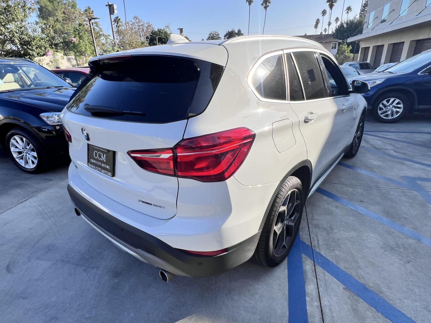 2016 White /Black BMW X1 xDrive28i (WBXHT3C38GP) with an 2.0L L4 DOHC 16V engine, 8A transmission, located at 30 S. Berkeley Avenue, Pasadena, CA, 91107, (626) 248-7567, 34.145447, -118.109398 - 2016 BMW X1 xDrive28i – White / Black Interior – Buy Here Pay Here Pasadena Luxury, performance, and practicality come together in this 2016 BMW X1 xDrive28i (VIN WBXHT3C38GP885411) featuring a white exterior over a black interior. This compact luxury SUV offers premium comfort, spirited perf - Photo#4