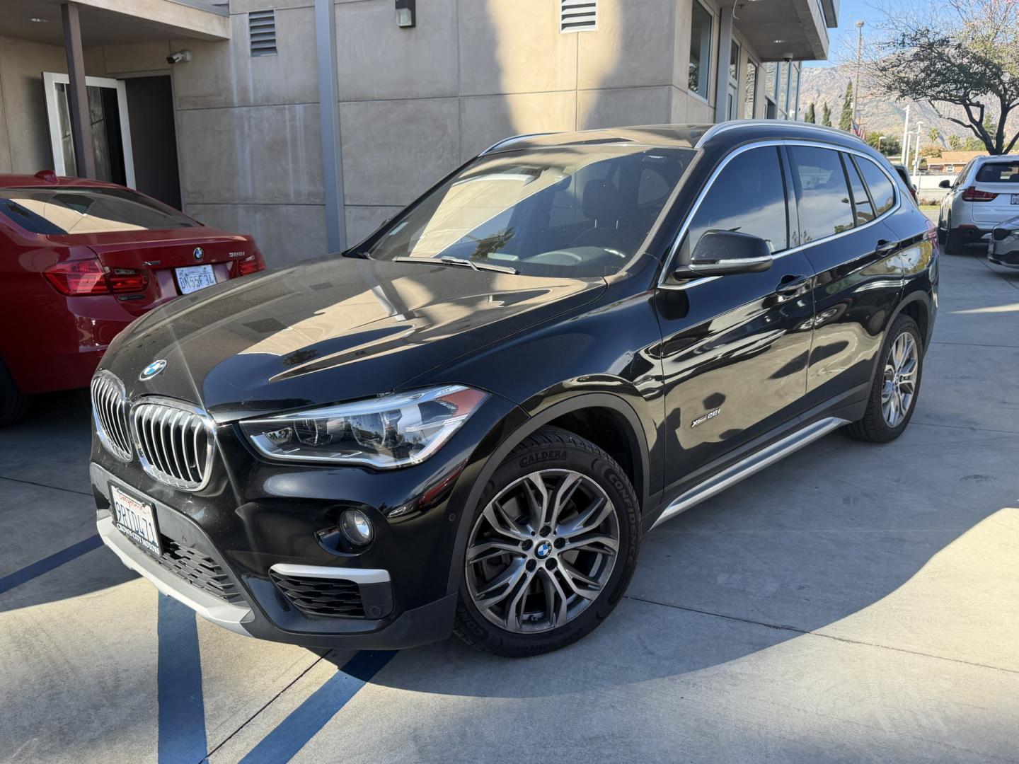 2016 Black /BLACK BMW X1 xDrive28i (WBXHT3Z30G4) with an 2.0L L4 DOHC 16V engine, 8A transmission, located at 30 S. Berkeley Avenue, Pasadena, CA, 91107, (626) 248-7567, 34.145447, -118.109398 - 2016 BMW X1 – Low Miles (79,000) – Buy Here Pay Here Financing – Pasadena, CA Looking for a BMW with low miles and easy financing in Pasadena? This 2016 BMW X1 (VIN: WBXHT3Z30G4A49250) has only 79,000 miles, making it an excellent choice for drivers who want luxury, reliability, and afforda - Photo#0