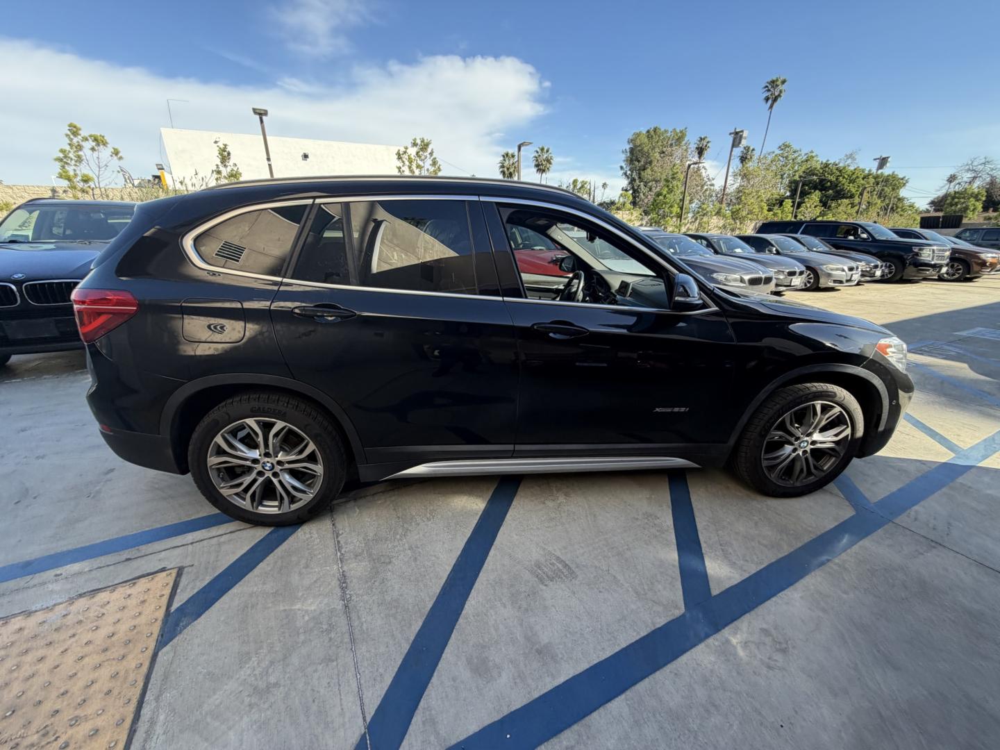 2016 Black /BLACK BMW X1 xDrive28i (WBXHT3Z30G4) with an 2.0L L4 DOHC 16V engine, 8A transmission, located at 30 S. Berkeley Avenue, Pasadena, CA, 91107, (626) 248-7567, 34.145447, -118.109398 - 2016 BMW X1 – Low Miles (79,000) – Buy Here Pay Here Financing – Pasadena, CA Looking for a BMW with low miles and easy financing in Pasadena? This 2016 BMW X1 (VIN: WBXHT3Z30G4A49250) has only 79,000 miles, making it an excellent choice for drivers who want luxury, reliability, and afforda - Photo#2