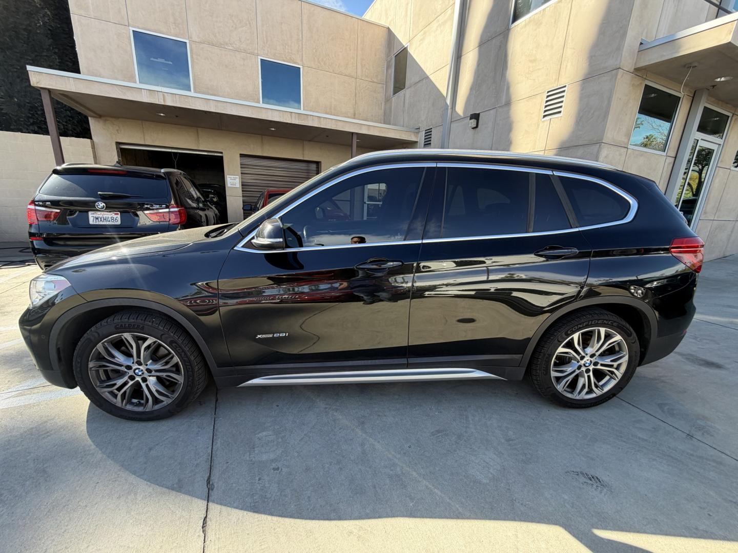 2016 Black /BLACK BMW X1 xDrive28i (WBXHT3Z30G4) with an 2.0L L4 DOHC 16V engine, 8A transmission, located at 30 S. Berkeley Avenue, Pasadena, CA, 91107, (626) 248-7567, 34.145447, -118.109398 - 2016 BMW X1 – Low Miles (79,000) – Buy Here Pay Here Financing – Pasadena, CA Looking for a BMW with low miles and easy financing in Pasadena? This 2016 BMW X1 (VIN: WBXHT3Z30G4A49250) has only 79,000 miles, making it an excellent choice for drivers who want luxury, reliability, and afforda - Photo#1