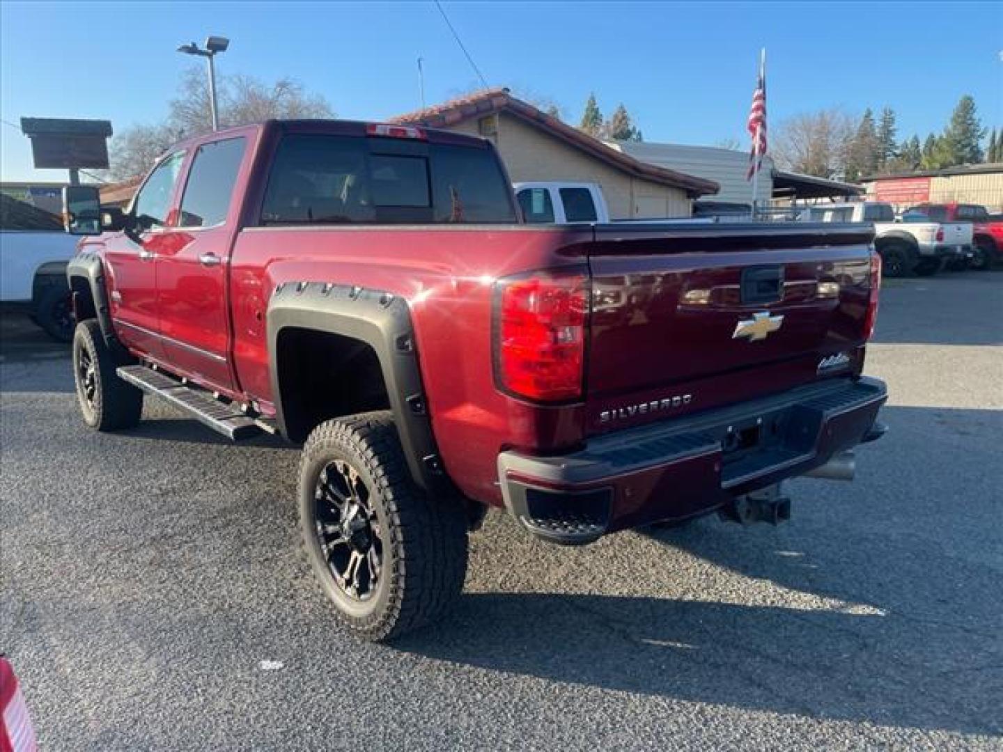 2016 Butte Red Metallic Chevrolet Silverado 2500HD High Country (1GC1KXE87GF) with an 6.6L Duramax 6.6L Diesel Turbo V8 397hp 765ft. lbs. Common Rail Direct Injection engine, Allison 1000 6-Speed Shiftable Automatic transmission, located at 800 Riverside Ave, Roseville, CA, 95678, 916-773-4549 & Toll Free: 866-719-4393, 38.732265, -121.291039 - DURAMAX DIESEL CREW CAB 4X4 HIGH COUNTY LIFTED ALLISON TRANSMISSION SERVICE RECORDS ON CLEAN CARFAX - Photo#4