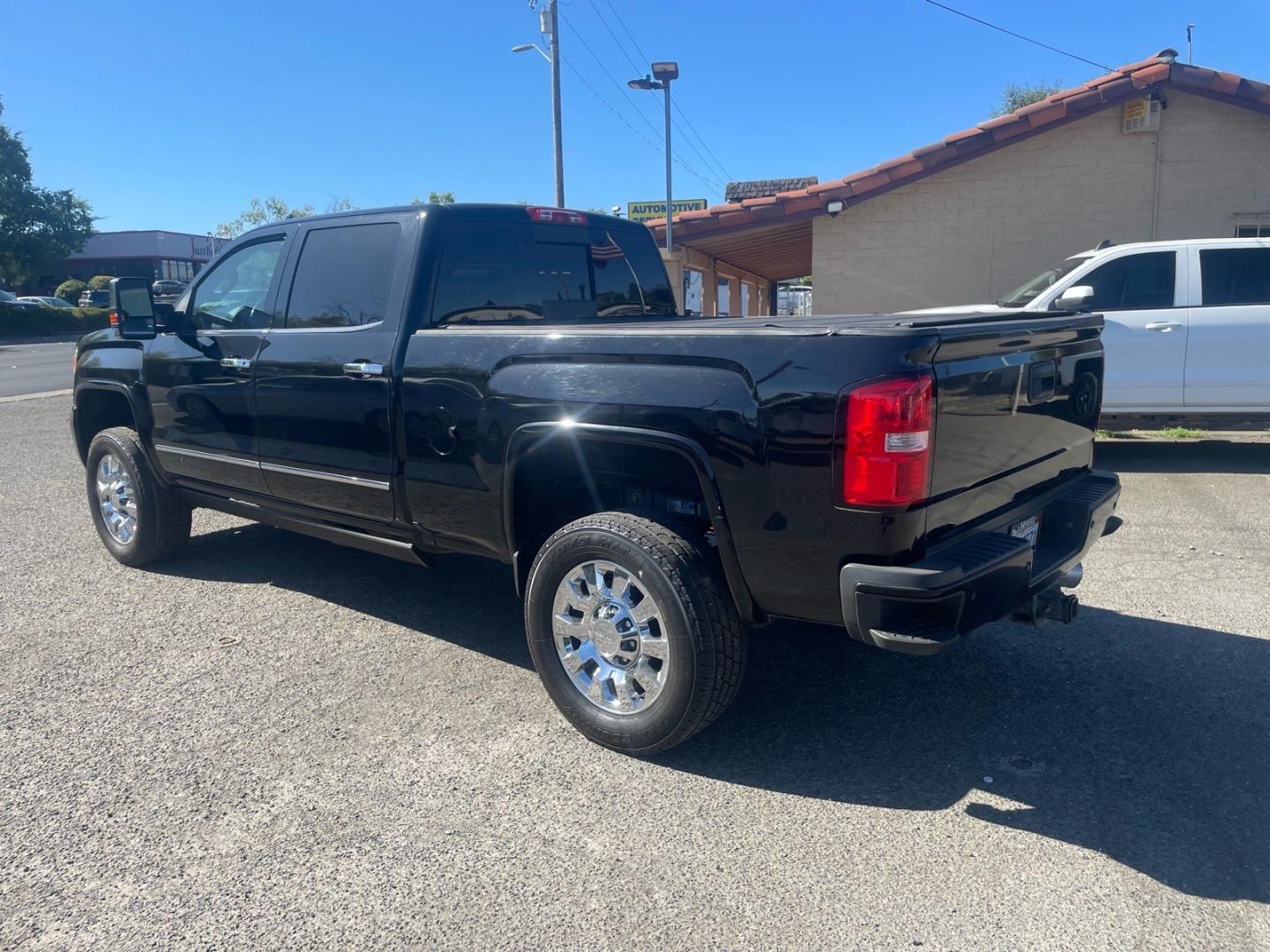 2016 Onyx Black GMC Sierra 2500HD Denali (1GT12UE83GF) with an 6.6L Duramax 6.6L Diesel Turbo V8 397hp 765ft. lbs. Common Rail Direct Injection engine, Allison 1000 6-Speed Shiftable Automatic transmission, located at 800 Riverside Ave, Roseville, CA, 95678, 916-773-4549 & Toll Free: 866-719-4393, 38.732265, -121.291039 - DURAMAX DIESEL CREW CAB 4X4 DENALI CP3 FUEL PUMP CONVERSION- Photo#2