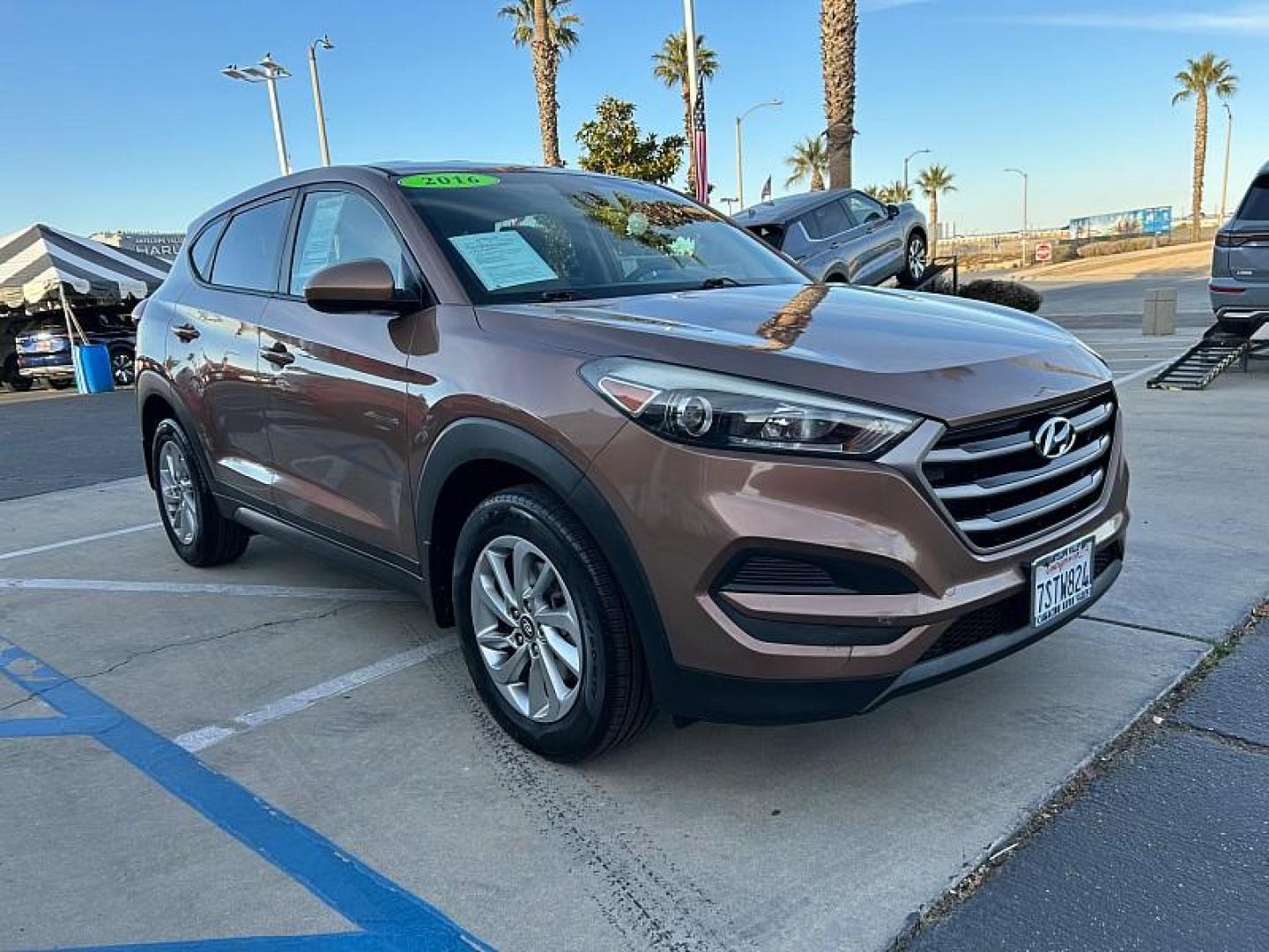 2016 GOLD Hyundai Tucson (KM8J23A42GU) with an 4-Cyl 2.0 Liter engine, Auto 6-Spd Shiftronic transmission, located at 412 Auto Vista Drive, Palmdale, 93551, (661) 945-0620, 34.592636, -118.136681- Photo#0