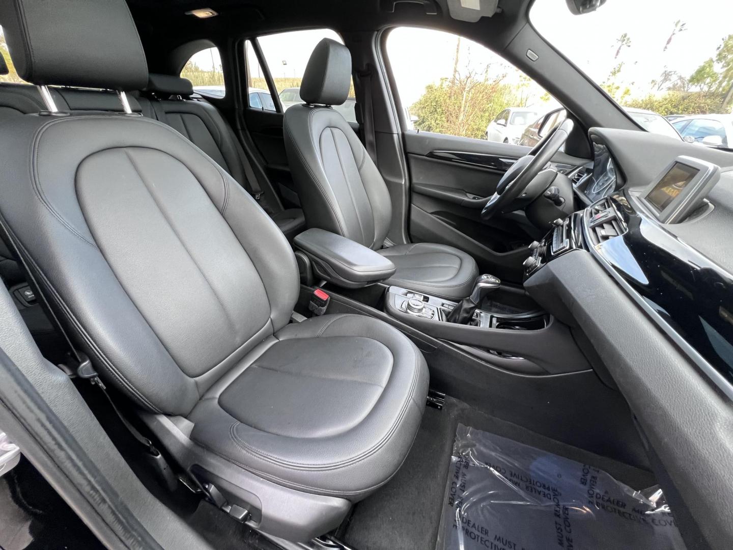 2017 Black /Black BMW X1 sDrive28i (WBXHU7C33H5) with an 2.0L L4 DOHC 16V engine, 8A transmission, located at 30 S. Berkeley Avenue, Pasadena, CA, 91107, (626) 248-7567, 34.145447, -118.109398 - Experience the pinnacle of luxury and versatility with the 2017 BMW X1, a compact SUV that delivers style, performance, and cutting-edge technology in one stunning package. With low miles for its year at just 79,804, this exceptional vehicle offers you an incredible opportunity to drive a nearly new - Photo#20