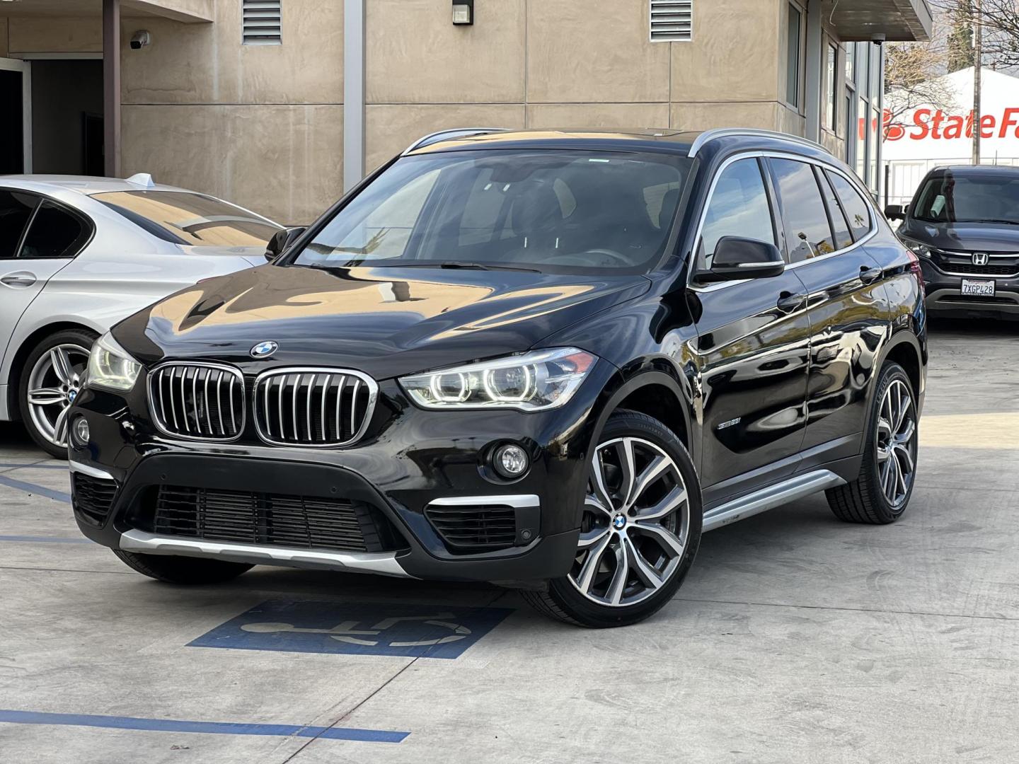 2017 Black /Black BMW X1 sDrive28i (WBXHU7C33H5) with an 2.0L L4 DOHC 16V engine, 8A transmission, located at 30 S. Berkeley Avenue, Pasadena, CA, 91107, (626) 248-7567, 34.145447, -118.109398 - Experience the pinnacle of luxury and versatility with the 2017 BMW X1, a compact SUV that delivers style, performance, and cutting-edge technology in one stunning package. With low miles for its year at just 79,804, this exceptional vehicle offers you an incredible opportunity to drive a nearly new - Photo#0