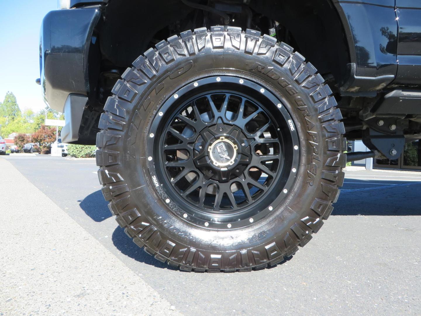 2017 BLACK Ford F-250 SD Platinum Crew Cab Short Bed 4WD (1FT7W2BT0HE) with an 6.7L V8 OHV 16V DIESEL engine, 6A transmission, located at 2630 Grass Valley Highway, Auburn, CA, 95603, (530) 508-5100, 38.937893, -121.095482 - Lifted F-250 featuring a SkyJacker long arm suspension system, Fox 2.5 remote reservoir coilovers, Fox 2.0 rear remote reservoir shocks, Fox dual steering stabilizers, 20" XD wheels, 37" Nitto Ridge Grappler tires, Racer X Mesh Grille, Airlift Air Bags, Painted badges, and window tint. - Photo#8