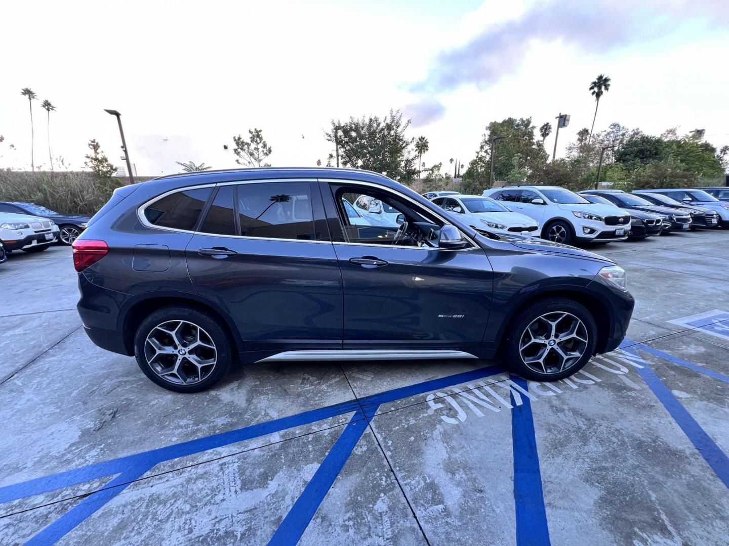2017 BMW X1 sDrive28i (WBXHU7C36HP) with an 2.0L L4 DOHC 16V engine, 8A transmission, located at 30 S. Berkeley Avenue, Pasadena, CA, 91107, (626) 248-7567, 34.145447, -118.109398 - Photo#5