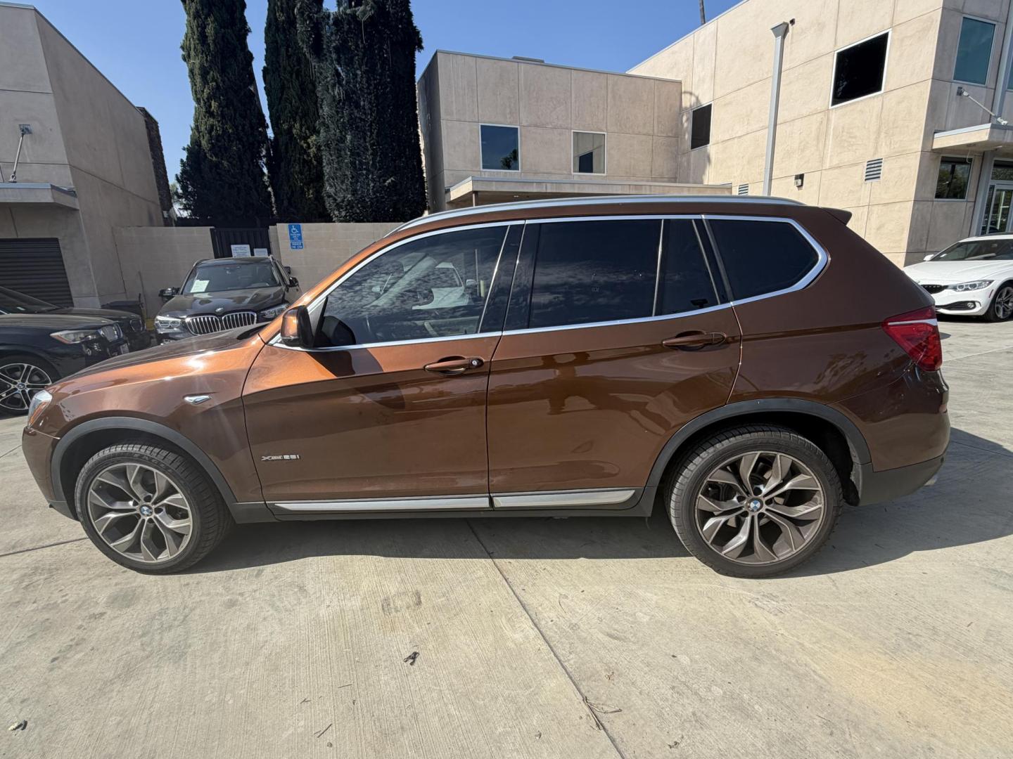 2017 Barcelona Red Metallic BMW X3 xDrive28i (5UXWX9C56H0) with an 2.0L L4 DOHC 16V engine, 8A transmission, located at 30 S. Berkeley Avenue, Pasadena, CA, 91107, (626) 248-7567, 34.145447, -118.109398 - Crown City Motors is a used “Buy Here Pay Here” car dealer in Pasadena CA. “Buy Here Pay Here” financing, means that when you purchase your vehicle from our dealership, that you make the payments to the dealership as well. We do not need the banks approval to get you approved for a used auto - Photo#1
