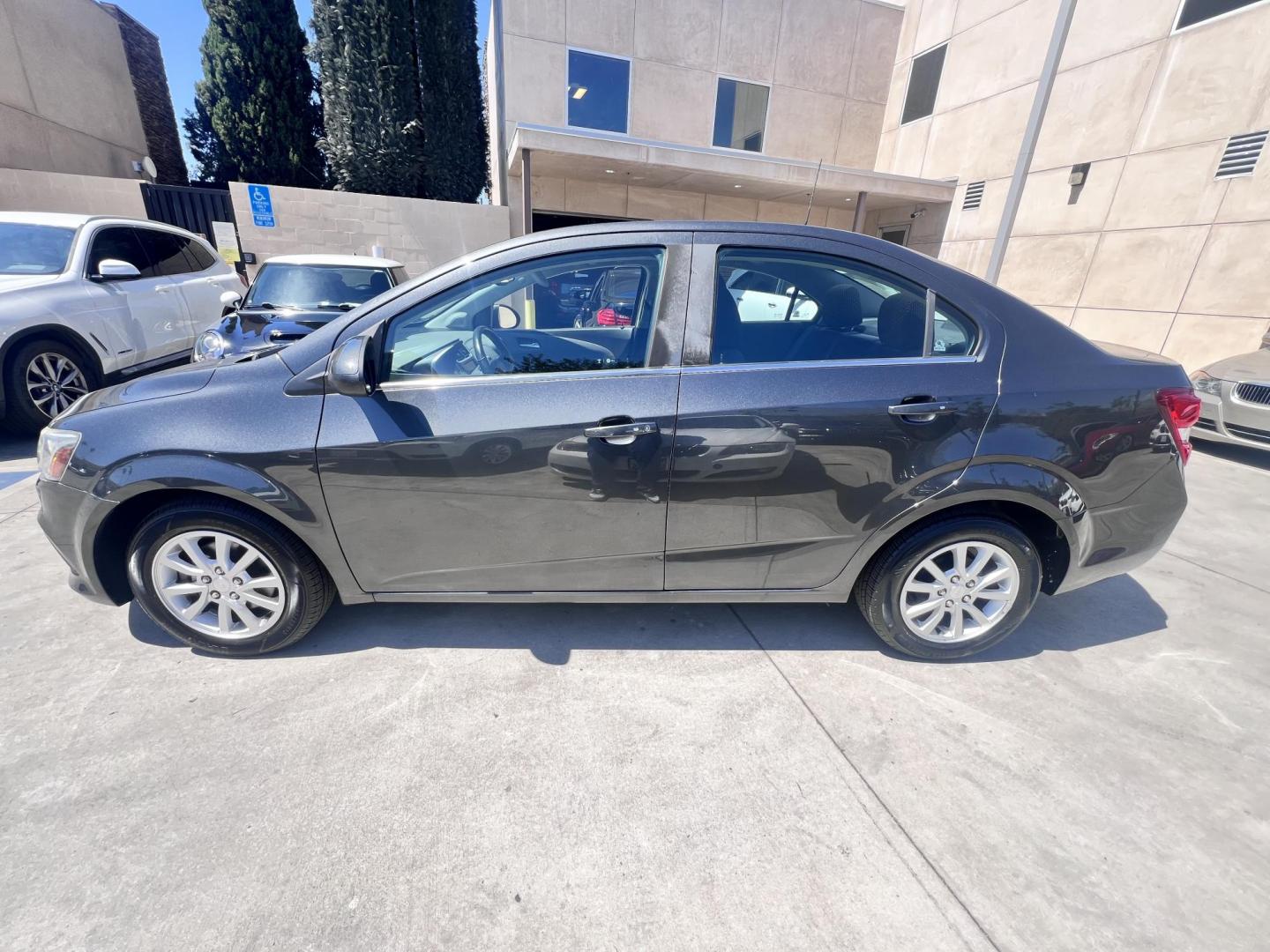 2017 Coliseum Gray /Black Chevrolet Sonic LT Manual Sedan (1G1JD5SHXH4) with an 1.8L L4 DOHC 24V engine, 5M transmission, located at 30 S. Berkeley Avenue, Pasadena, CA, 91107, (626) 248-7567, 34.145447, -118.109398 - 2017 Chevrolet Sonic Sedan – Gray – 130,750 miles – Buy Here Pay Here Pasadena, CA VIN: 1G1JD5SHXH4166595 Looking for an affordable, fuel-efficient sedan that’s easy to own and simple to finance? This 2017 Chevrolet Sonic Sedan in Gray checks all the boxes. It’s a compact, city-frien - Photo#1