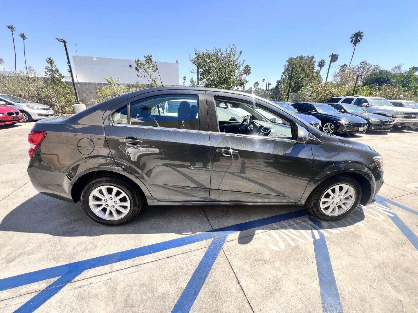 2017 Coliseum Gray /Black Chevrolet Sonic LT Manual Sedan (1G1JD5SHXH4) with an 1.8L L4 DOHC 24V engine, 5M transmission, located at 30 S. Berkeley Avenue, Pasadena, CA, 91107, (626) 248-7567, 34.145447, -118.109398 - 2017 Chevrolet Sonic Sedan – Gray – 130,750 miles – Buy Here Pay Here Pasadena, CA VIN: 1G1JD5SHXH4166595 Looking for an affordable, fuel-efficient sedan that’s easy to own and simple to finance? This 2017 Chevrolet Sonic Sedan in Gray checks all the boxes. It’s a compact, city-frien - Photo#3