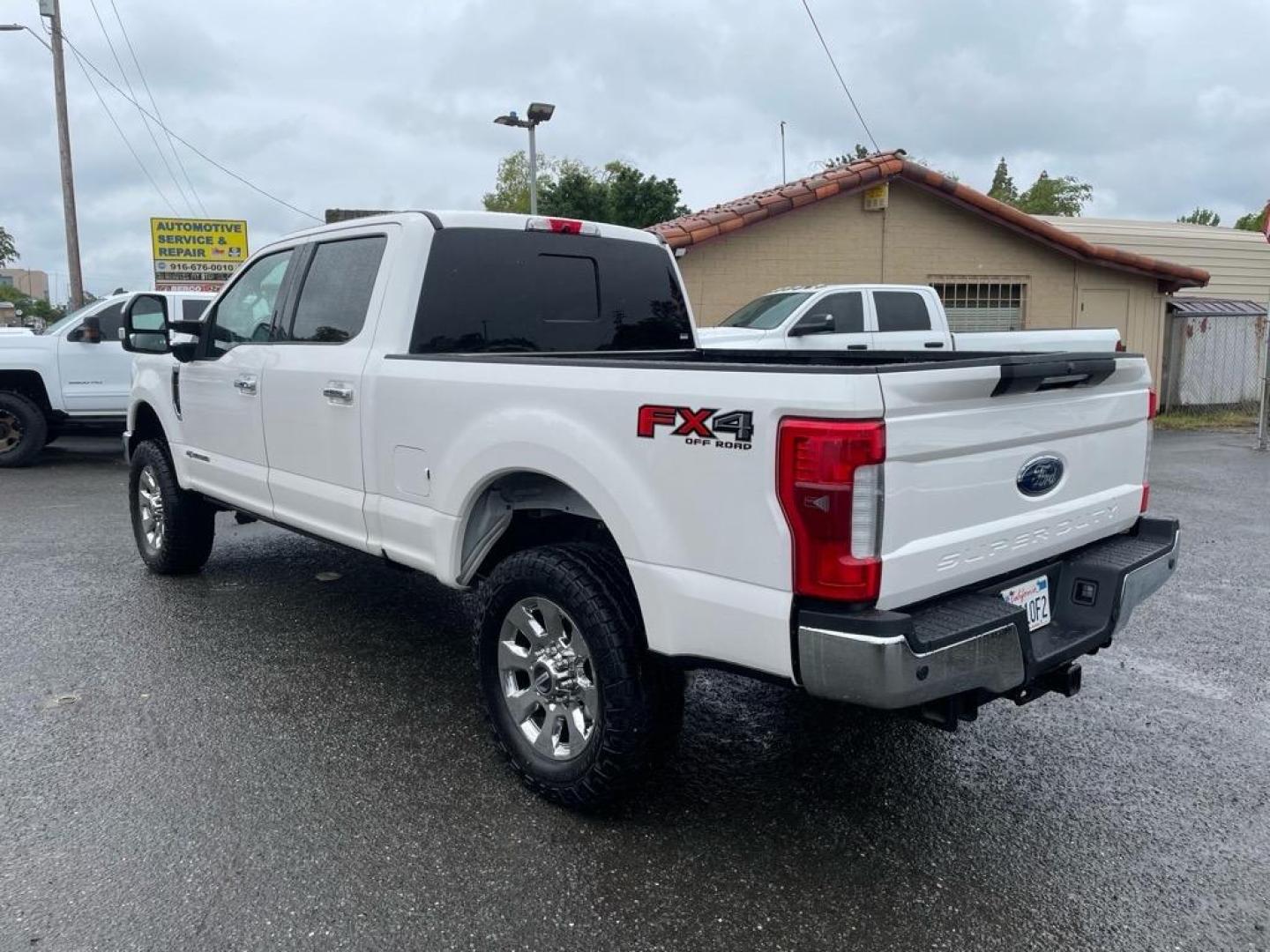 2017 Oxford White Ford F-250 Super Duty Lariat (1FT7W2BT8HE) with an 6.7L Power Stroke 6.7L Biodiesel Turbo V8 440hp 925ft. lbs. Common Rail Direct Injection engine, 6-Speed Shiftable Automatic transmission, located at 800 Riverside Ave, Roseville, CA, 95678, 916-773-4549 & Toll Free: 866-719-4393, 38.732265, -121.291039 - DIESEL CREW CAB 4X4 FX4 LARIAT TWIN PANEL MOON ROOF CLEAN CARFAX - Photo#3