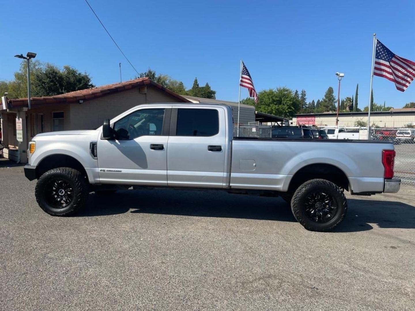 2017 Ingot Silver Ford F-350 Super Duty XL (1FT8W3BT2HE) with an 6.7L Power Stroke 6.7L Biodiesel Turbo V8 440hp 925ft. lbs. Common Rail Direct Injection engine, 6-Speed Shiftable Automatic transmission, located at 800 Riverside Ave, Roseville, CA, 95678, 916-773-4549 & Toll Free: 866-719-4393, 38.732265, -121.291039 - DIESEL CREW CAB 4X4 LIFTED CLEAN CARFAX - Photo#4
