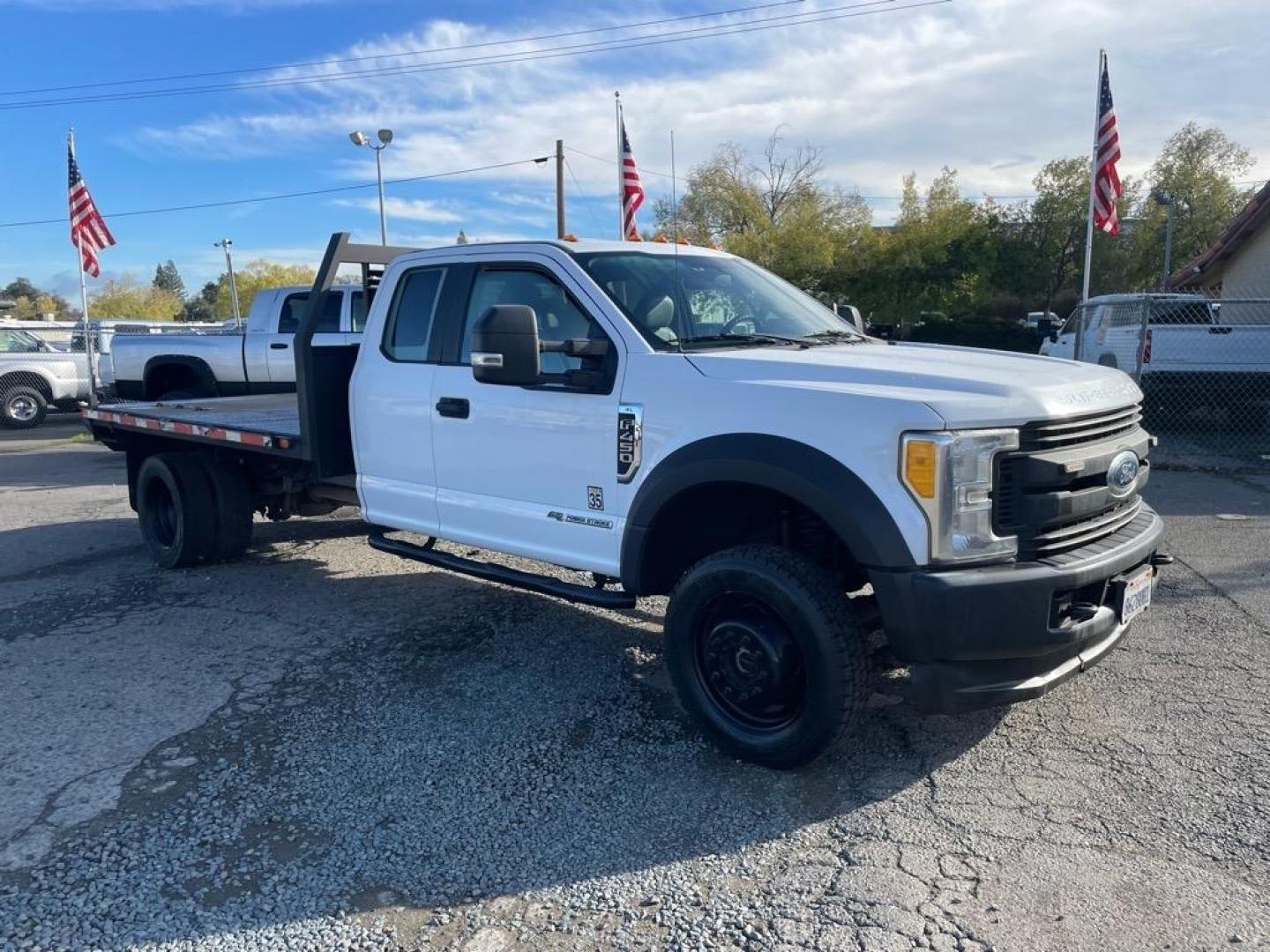2017 Oxford White Ford F-450 Super Duty XL (1FD0X4HTXHE) with an 6.7L Power Stroke 6.7L Biodiesel Turbo V8 440hp 925ft. lbs. Common Rail Direct Injection engine, 6-Speed Shiftable Automatic transmission, located at 800 Riverside Ave, Roseville, CA, 95678, 916-773-4549 & Toll Free: 866-719-4393, 38.732265, -121.291039 - DIESEL SUPER CAB 4X4 11 FOOT FLAT BED ONE OWNER - Photo#1
