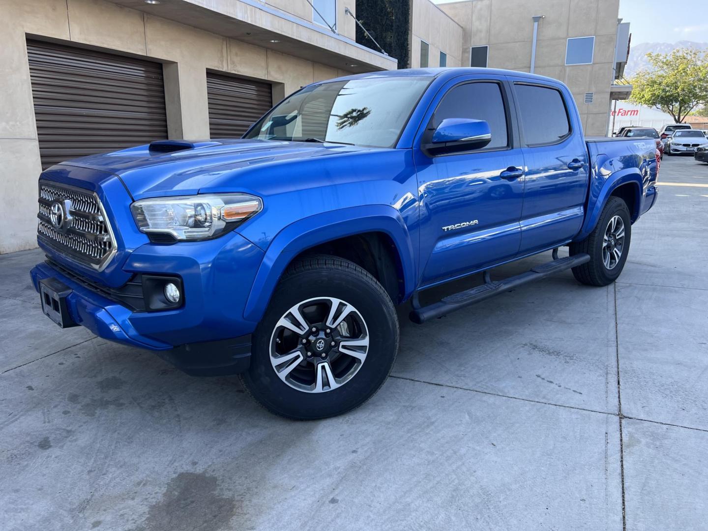 2017 Blazing Blue Metallic /Gray Toyota Tacoma SR5 Double Cab Long Bed V6 6AT 2WD (5TFAZ5CN3HX) with an 3.6L V6 DOHC 24V engine, 6A transmission, located at 30 S. Berkeley Avenue, Pasadena, CA, 91107, (626) 248-7567, 34.145447, -118.109398 - 2017 Toyota Tacoma SR5 – V6, Double Cab – Blazing Blue Metallic – Buy Here Pay Here Pasadena Looking for a dependable and powerful midsize pickup that’s ready for work or play? Check out this 2017 Toyota Tacoma SR5 Double Cab finished in the eye-catching Blazing Blue Metallic. This Tacoma o - Photo#0