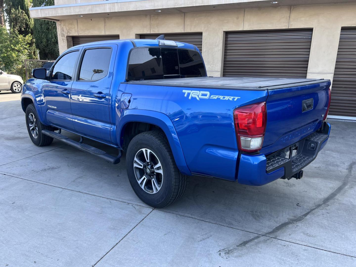 2017 Blazing Blue Metallic /Gray Toyota Tacoma SR5 Double Cab Long Bed V6 6AT 2WD (5TFAZ5CN3HX) with an 3.6L V6 DOHC 24V engine, 6A transmission, located at 30 S. Berkeley Avenue, Pasadena, CA, 91107, (626) 248-7567, 34.145447, -118.109398 - 2017 Toyota Tacoma SR5 – V6, Double Cab – Blazing Blue Metallic – Buy Here Pay Here Pasadena Looking for a dependable and powerful midsize pickup that’s ready for work or play? Check out this 2017 Toyota Tacoma SR5 Double Cab finished in the eye-catching Blazing Blue Metallic. This Tacoma o - Photo#2