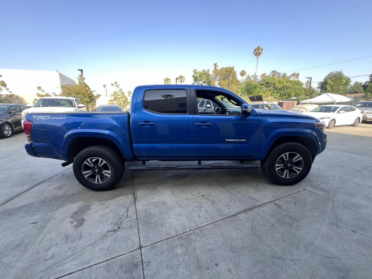 2017 Blazing Blue Metallic /Gray Toyota Tacoma SR5 Double Cab Long Bed V6 6AT 2WD (5TFAZ5CN3HX) with an 3.6L V6 DOHC 24V engine, 6A transmission, located at 30 S. Berkeley Avenue, Pasadena, CA, 91107, (626) 248-7567, 34.145447, -118.109398 - 2017 Toyota Tacoma SR5 – V6, Double Cab – Blazing Blue Metallic – Buy Here Pay Here Pasadena Looking for a dependable and powerful midsize pickup that’s ready for work or play? Check out this 2017 Toyota Tacoma SR5 Double Cab finished in the eye-catching Blazing Blue Metallic. This Tacoma o - Photo#4