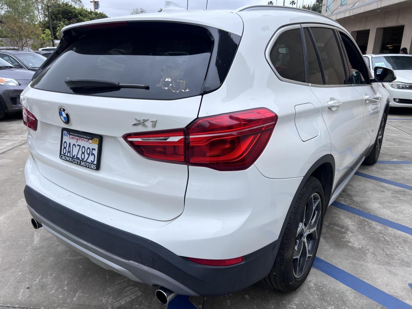 2018 White /Beige BMW X1 sDrive28i (WBXHU7C38J5) with an 2.0L L4 DOHC 16V engine, 8A transmission, located at 30 S. Berkeley Avenue, Pasadena, CA, 91107, (626) 248-7567, 34.145447, -118.109398 - Crown City Motors is a used “Buy Here Pay Here” car dealer in Pasadena CA. “Buy Here Pay Here” financing, means that when you purchase your vehicle from our dealership, that you make the payments to the dealership as well. We do not need the banks approval to get you approved for a used auto - Photo#4