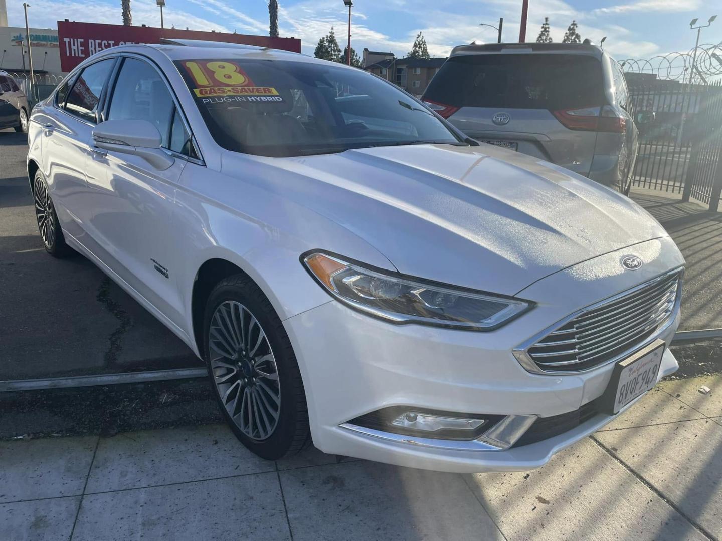 2018 WHITE Ford Fusion Energi Titanium (3FA6P0SUXJR) with an 2.0L L4 DOHC 16V HYBRID engine, CVT transmission, located at 744 E Miner Ave, Stockton, CA, 95202, (209) 944-5770, 37.956863, -121.282082 - PLUS TAXES AND FEEDS - Photo#0