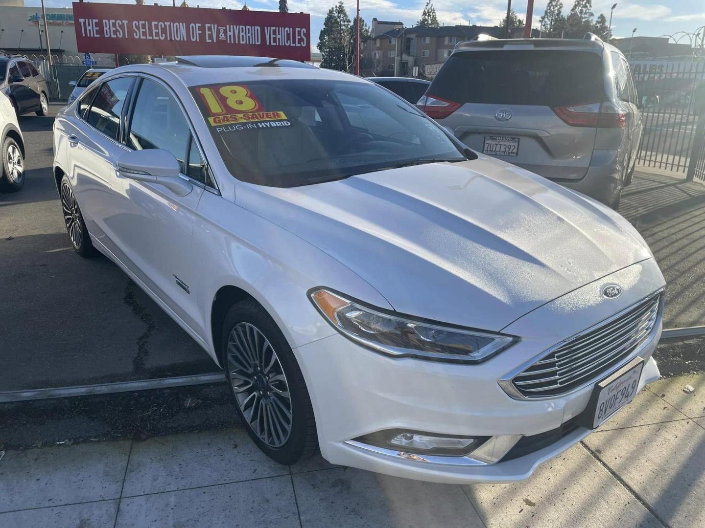 2018 WHITE Ford Fusion Energi Titanium (3FA6P0SUXJR) with an 2.0L L4 DOHC 16V HYBRID engine, CVT transmission, located at 744 E Miner Ave, Stockton, CA, 95202, (209) 944-5770, 37.956863, -121.282082 - PLUS TAXES AND FEEDS - Photo#1