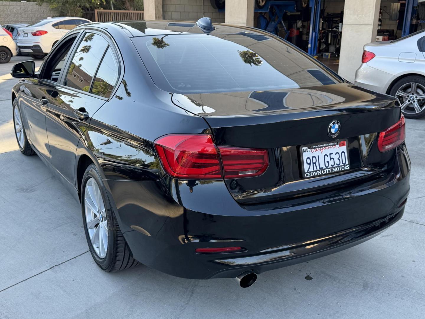 2018 Black /BLACK BMW 3-Series 320i Sedan (WBA8E1G5XJN) with an 2.0L L4 DOHC 16V engine, 8A transmission, located at 30 S. Berkeley Avenue, Pasadena, CA, 91107, (626) 248-7567, 34.145447, -118.109398 - Crown City Motors is a used “Buy Here Pay Here” car dealer in Pasadena CA. “Buy Here Pay Here” financing, means that when you purchase your vehicle from our dealership, that you make the payments to the dealership as well. We do not need the banks approval to get you approved for a used auto - Photo#2