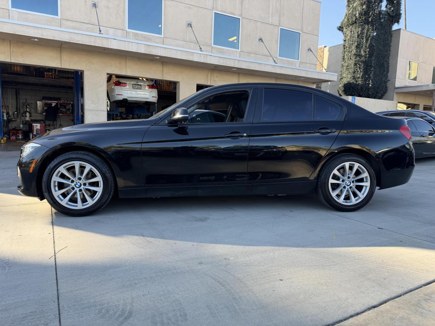 2018 Black /BLACK BMW 3-Series 320i Sedan (WBA8E1G5XJN) with an 2.0L L4 DOHC 16V engine, 8A transmission, located at 30 S. Berkeley Avenue, Pasadena, CA, 91107, (626) 248-7567, 34.145447, -118.109398 - Crown City Motors is a used “Buy Here Pay Here” car dealer in Pasadena CA. “Buy Here Pay Here” financing, means that when you purchase your vehicle from our dealership, that you make the payments to the dealership as well. We do not need the banks approval to get you approved for a used auto - Photo#1