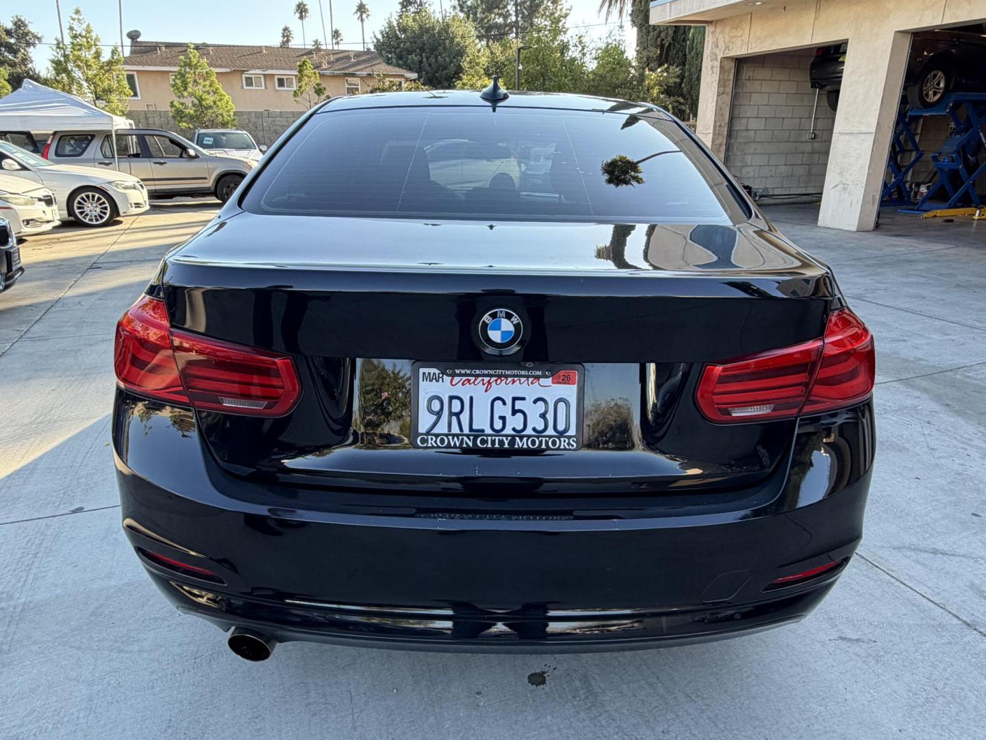 2018 Black /BLACK BMW 3-Series 320i Sedan (WBA8E1G5XJN) with an 2.0L L4 DOHC 16V engine, 8A transmission, located at 30 S. Berkeley Avenue, Pasadena, CA, 91107, (626) 248-7567, 34.145447, -118.109398 - Crown City Motors is a used “Buy Here Pay Here” car dealer in Pasadena CA. “Buy Here Pay Here” financing, means that when you purchase your vehicle from our dealership, that you make the payments to the dealership as well. We do not need the banks approval to get you approved for a used auto - Photo#5