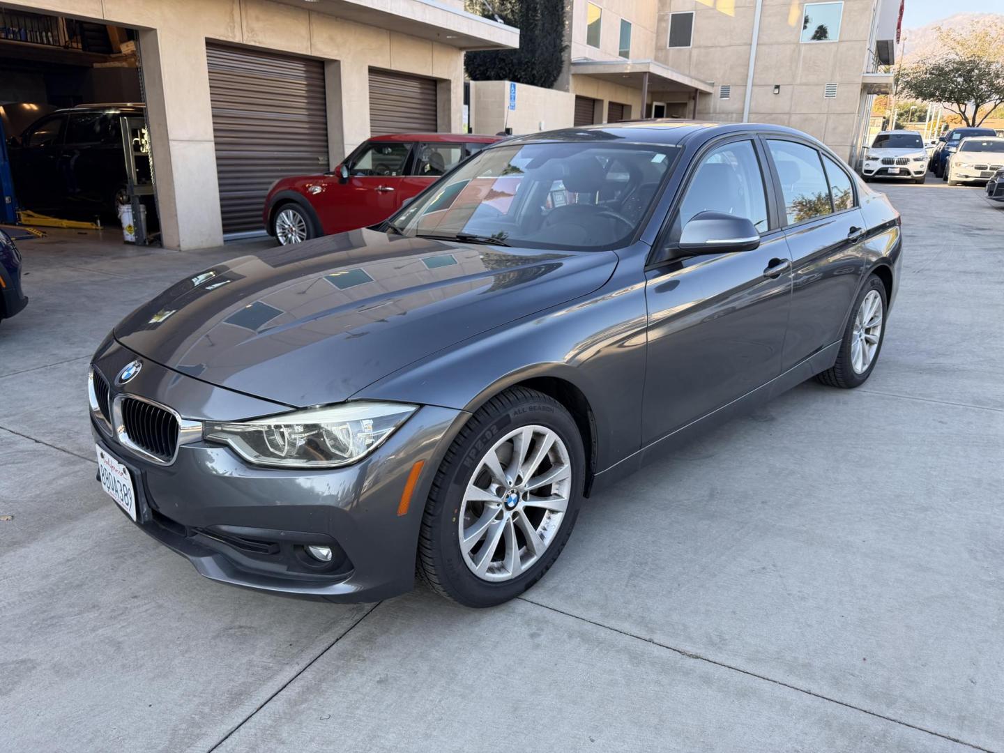 2018 Gray metallic /BLACK BMW 3-Series 320i Sedan (WBA8E1G57JN) with an 2.0L L4 DOHC 16V engine, 8A transmission, located at 30 S. Berkeley Avenue, Pasadena, CA, 91107, (626) 248-7567, 34.145447, -118.109398 - Crown City Motors is a used “Buy Here Pay Here” car dealer in Pasadena CA. “Buy Here Pay Here” financing, means that when you purchase your vehicle from our dealership, that you make the payments to the dealership as well. We do not need the banks approval to get you approved for a used auto - Photo#0