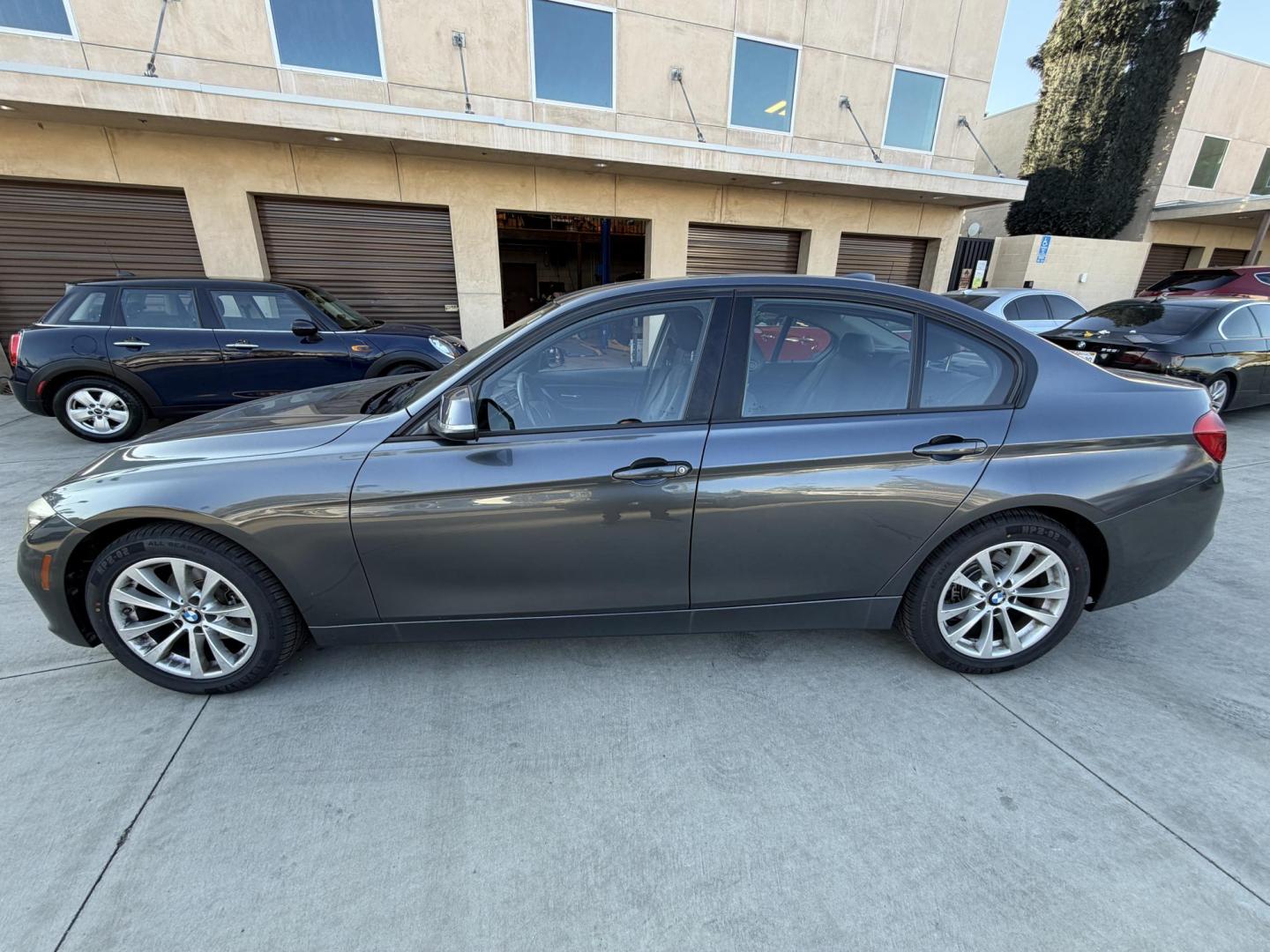 2018 Gray metallic /BLACK BMW 3-Series 320i Sedan (WBA8E1G57JN) with an 2.0L L4 DOHC 16V engine, 8A transmission, located at 30 S. Berkeley Avenue, Pasadena, CA, 91107, (626) 248-7567, 34.145447, -118.109398 - Crown City Motors is a used “Buy Here Pay Here” car dealer in Pasadena CA. “Buy Here Pay Here” financing, means that when you purchase your vehicle from our dealership, that you make the payments to the dealership as well. We do not need the banks approval to get you approved for a used auto - Photo#1