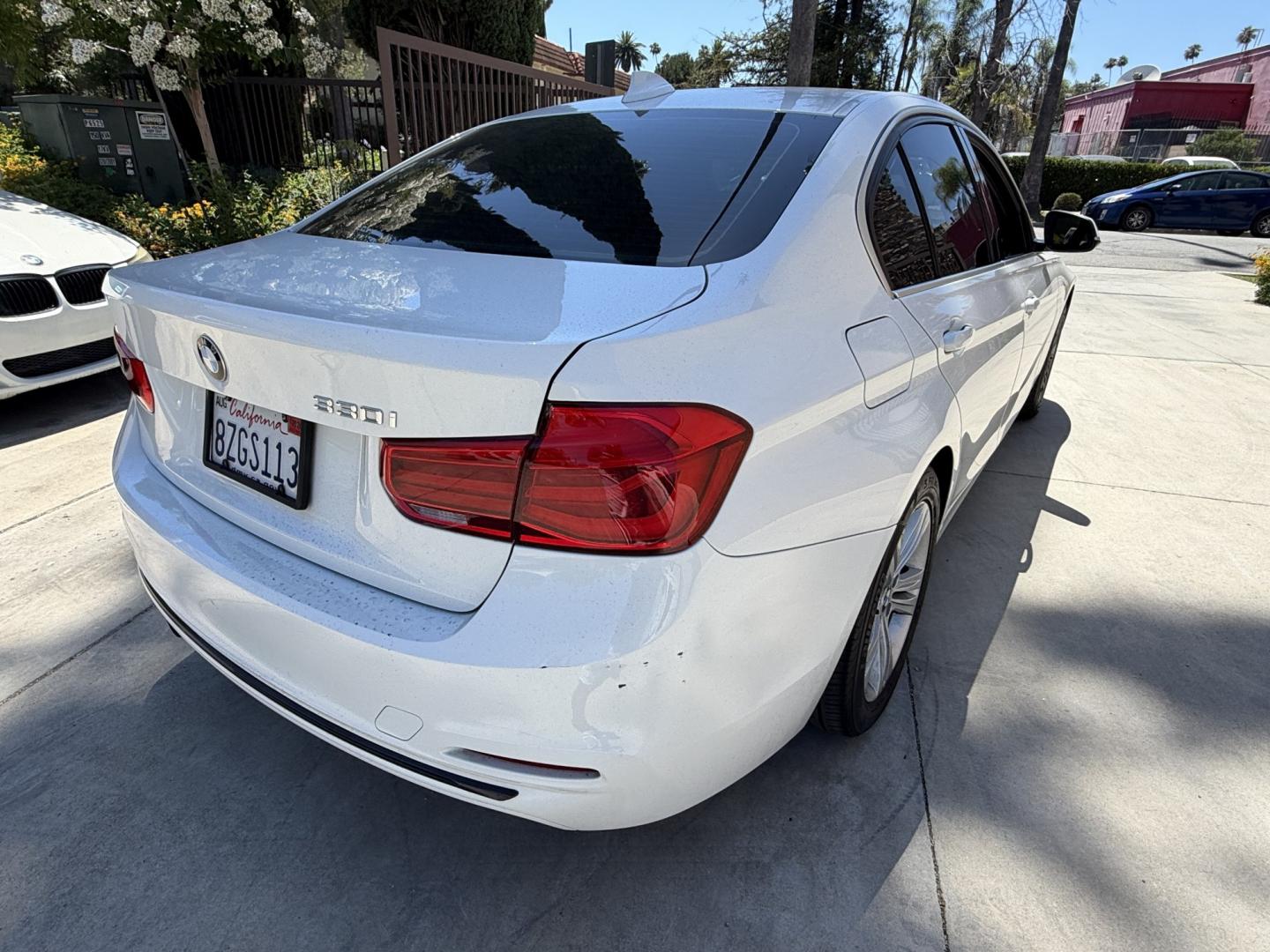 2018 Black /White BMW 3-Series 330i SULEV Sedan (WBA8B9C54JE) with an 3.0L L6 DOHC 24V engine, 8A transmission, located at 30 S. Berkeley Avenue, Pasadena, CA, 91107, (626) 248-7567, 34.145447, -118.109398 - Crown City Motors is a used “Buy Here Pay Here” car dealer in Pasadena CA. “Buy Here Pay Here” financing, means that when you purchase your vehicle from our dealership, that you make the payments to the dealership as well. We do not need the banks approval to get you approved for a used auto - Photo#2