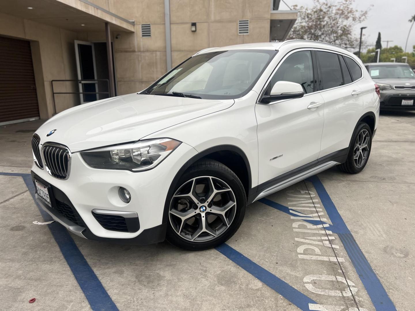 2018 White /Beige BMW X1 sDrive28i (WBXHU7C38J5) with an 2.0L L4 DOHC 16V engine, 8A transmission, located at 30 S. Berkeley Avenue, Pasadena, CA, 91107, (626) 248-7567, 34.145447, -118.109398 - Crown City Motors is a used “Buy Here Pay Here” car dealer in Pasadena CA. “Buy Here Pay Here” financing, means that when you purchase your vehicle from our dealership, that you make the payments to the dealership as well. We do not need the banks approval to get you approved for a used auto - Photo#6