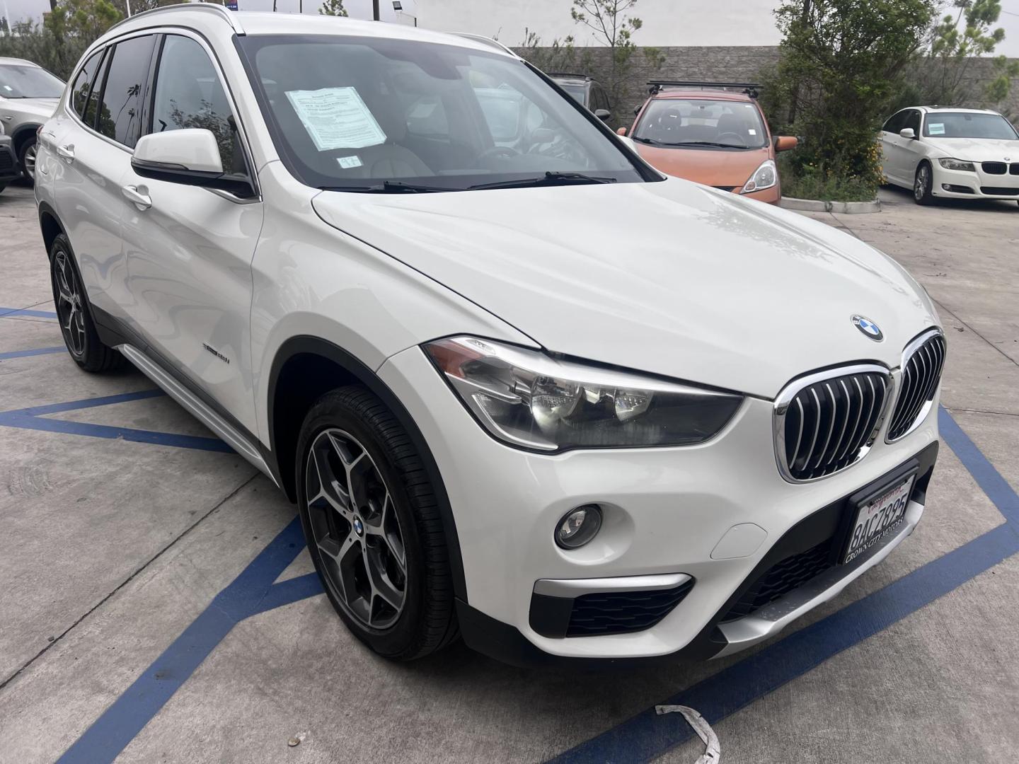 2018 White /Beige BMW X1 sDrive28i (WBXHU7C38J5) with an 2.0L L4 DOHC 16V engine, 8A transmission, located at 30 S. Berkeley Avenue, Pasadena, CA, 91107, (626) 248-7567, 34.145447, -118.109398 - Crown City Motors is a used “Buy Here Pay Here” car dealer in Pasadena CA. “Buy Here Pay Here” financing, means that when you purchase your vehicle from our dealership, that you make the payments to the dealership as well. We do not need the banks approval to get you approved for a used auto - Photo#12