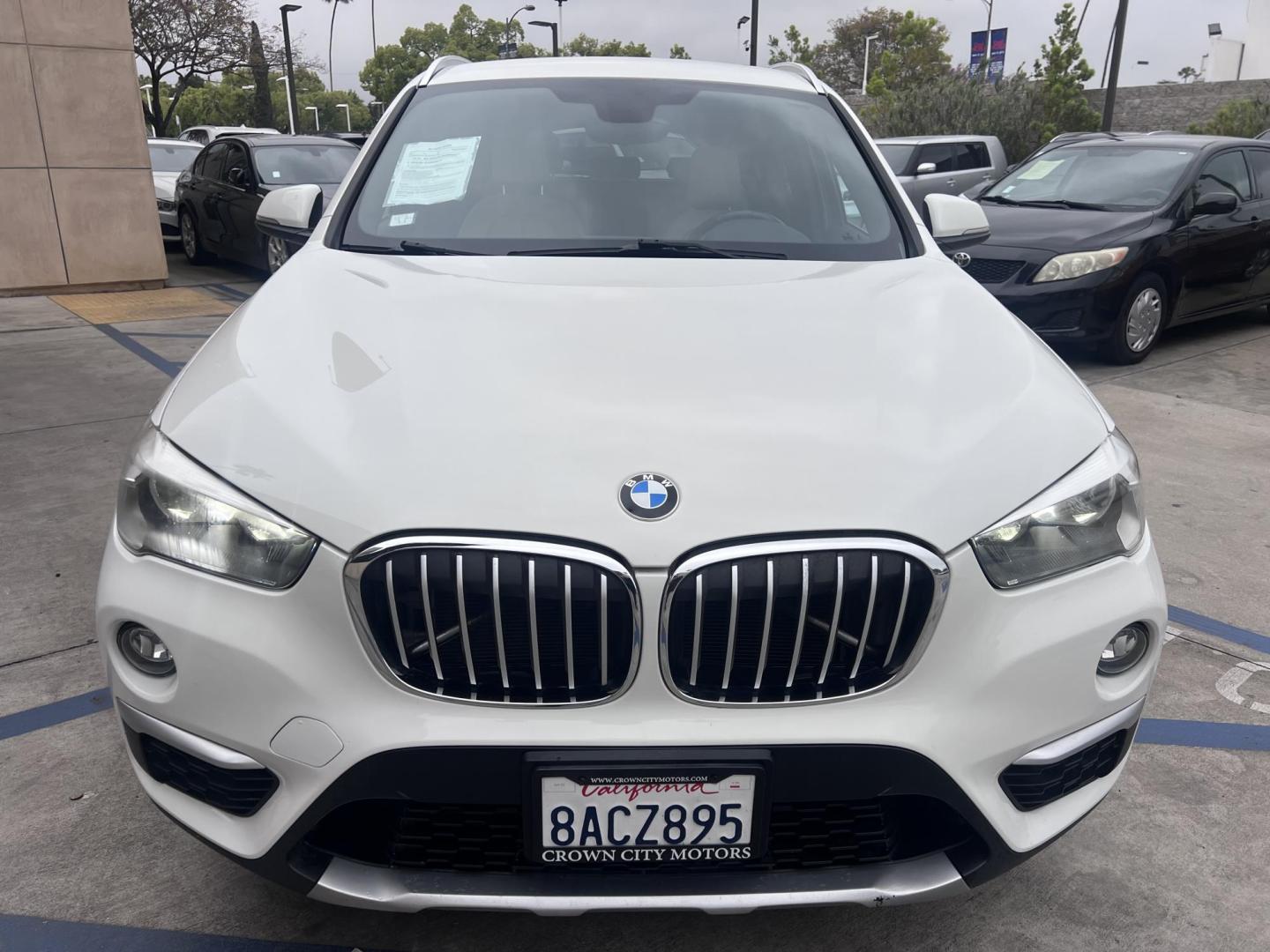 2018 White /Beige BMW X1 sDrive28i (WBXHU7C38J5) with an 2.0L L4 DOHC 16V engine, 8A transmission, located at 30 S. Berkeley Avenue, Pasadena, CA, 91107, (626) 248-7567, 34.145447, -118.109398 - Crown City Motors is a used “Buy Here Pay Here” car dealer in Pasadena CA. “Buy Here Pay Here” financing, means that when you purchase your vehicle from our dealership, that you make the payments to the dealership as well. We do not need the banks approval to get you approved for a used auto - Photo#13