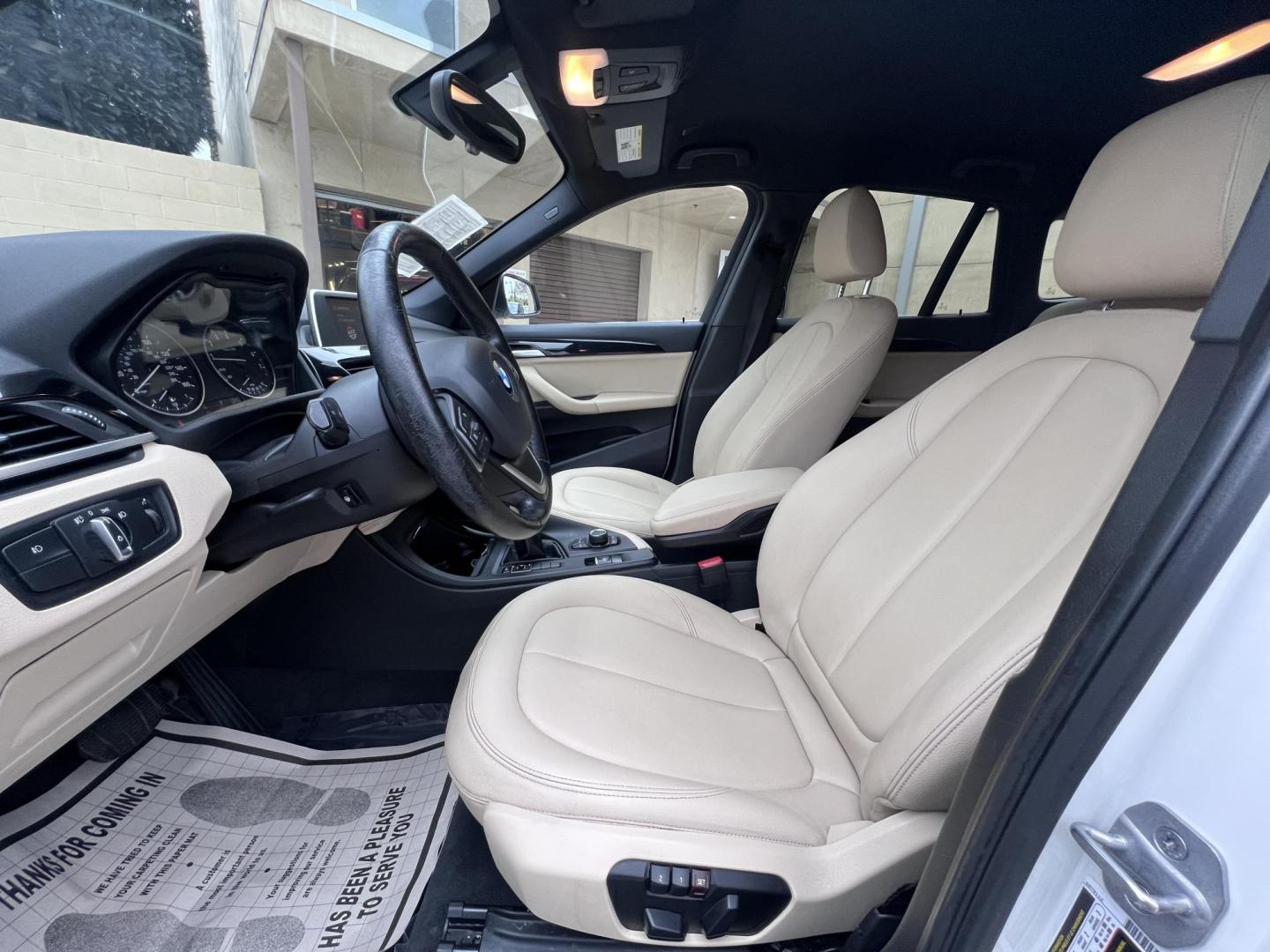 2018 White /Beige BMW X1 sDrive28i (WBXHU7C38J5) with an 2.0L L4 DOHC 16V engine, 8A transmission, located at 30 S. Berkeley Avenue, Pasadena, CA, 91107, (626) 248-7567, 34.145447, -118.109398 - Crown City Motors is a used “Buy Here Pay Here” car dealer in Pasadena CA. “Buy Here Pay Here” financing, means that when you purchase your vehicle from our dealership, that you make the payments to the dealership as well. We do not need the banks approval to get you approved for a used auto - Photo#17