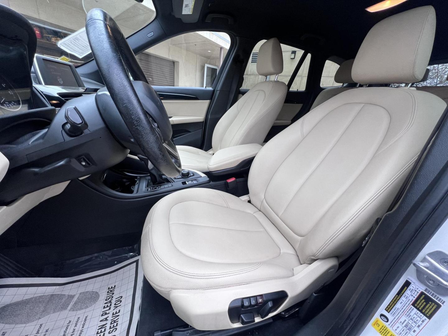 2018 White /Beige BMW X1 sDrive28i (WBXHU7C38J5) with an 2.0L L4 DOHC 16V engine, 8A transmission, located at 30 S. Berkeley Avenue, Pasadena, CA, 91107, (626) 248-7567, 34.145447, -118.109398 - Crown City Motors is a used “Buy Here Pay Here” car dealer in Pasadena CA. “Buy Here Pay Here” financing, means that when you purchase your vehicle from our dealership, that you make the payments to the dealership as well. We do not need the banks approval to get you approved for a used auto - Photo#18